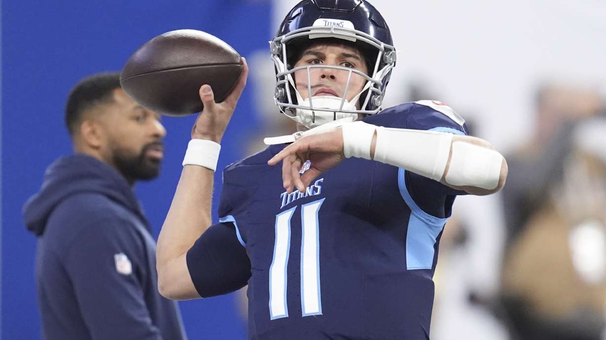 Tennessee Titans quarterback Mason Rudolph (11) warms up before an NFL football game against the Indianapolis Colts, Sunday, Dec. 22, 2024, in Indianapolis.