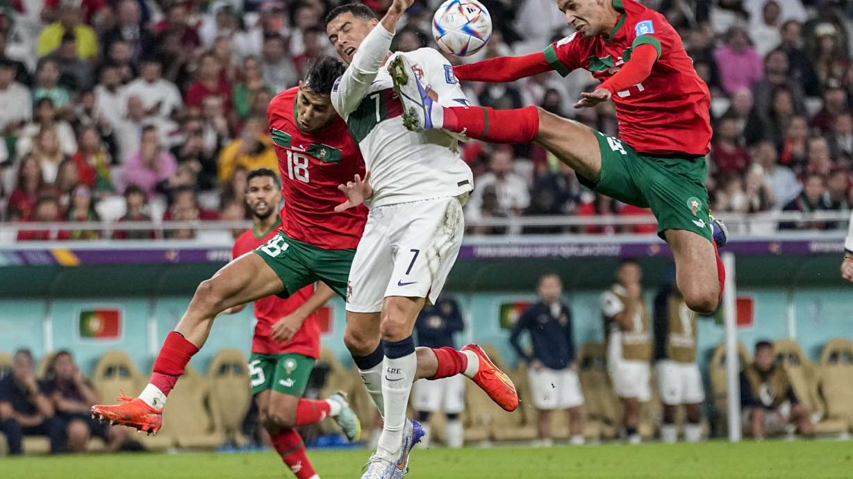FILE - Morocco's Bilal El Khannous, right, fights for the ball with Portugal's Cristiano Ronaldo during the World Cup quarterfinal soccer match between Morocco and Portugal, at Al Thumama Stadium in Doha, Qatar, Saturday, Dec. 10, 2022.