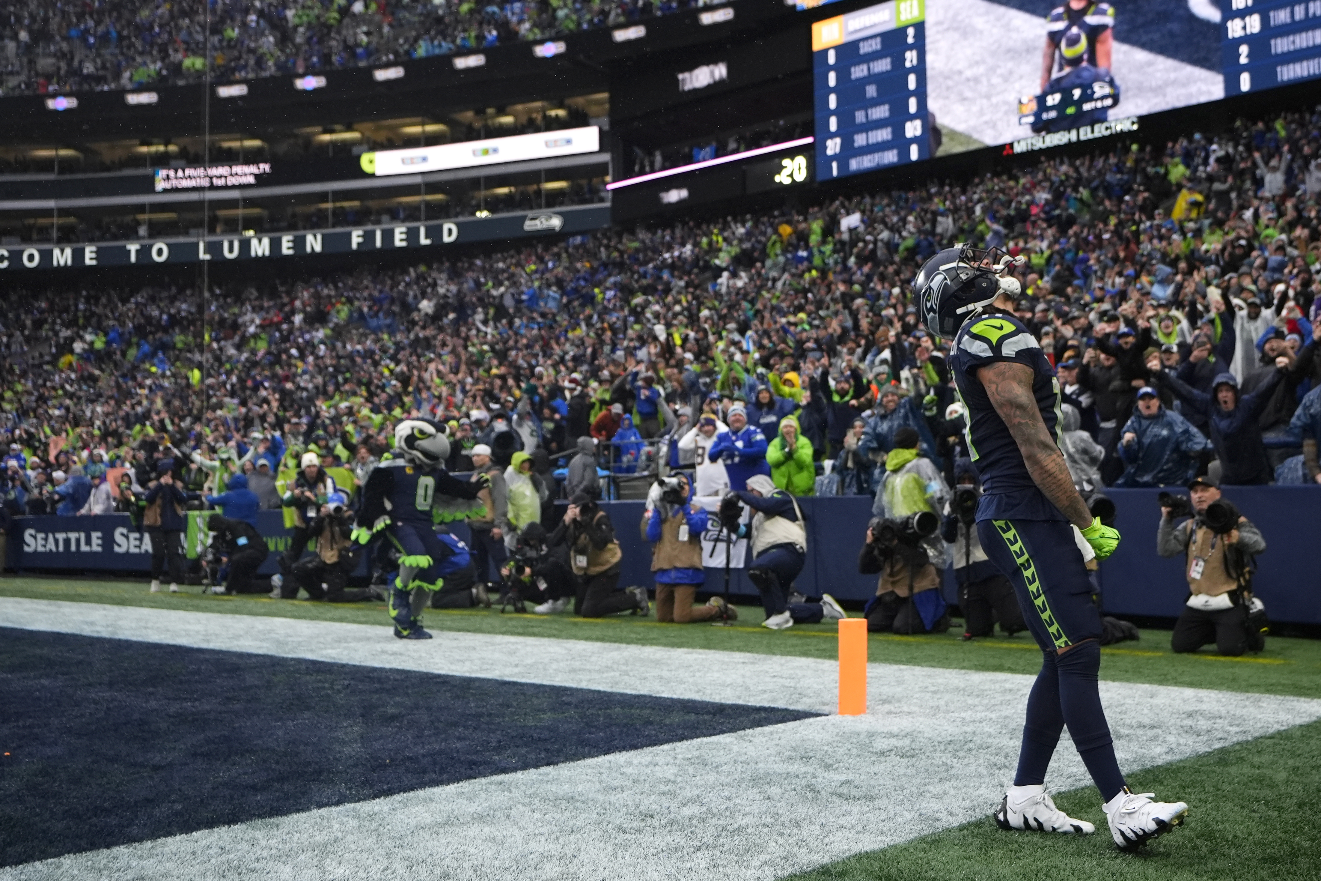 Seattle Seahawks wide receiver Jaxon Smith-Njigba (11) celebrates after scoring an 18-yard touchdown during the first half of an NFL football game against the Minnesota Vikings, Sunday, Dec. 22, 2024, in Seattle.