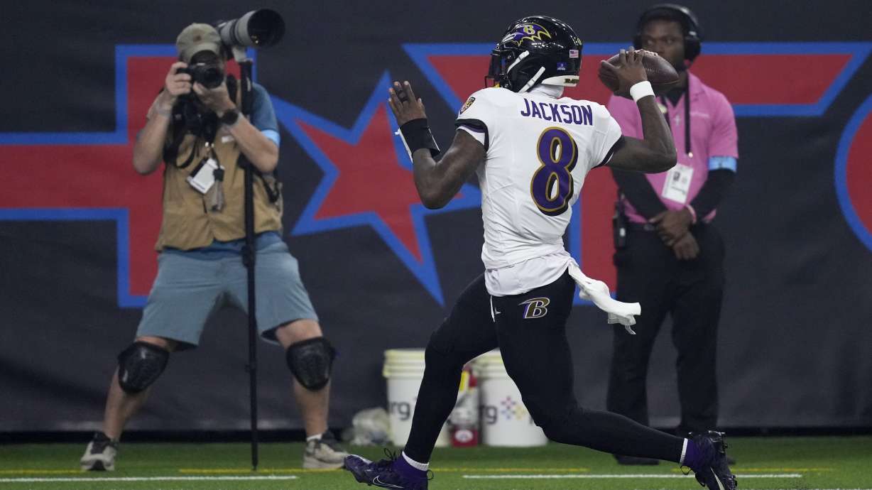 Baltimore Ravens quarterback Lamar Jackson (8) celebrates after a 48-yard touchdown run during the second half of an NFL football game against the Houston Texans, Wednesday, Dec. 25, 2024, in Houston.