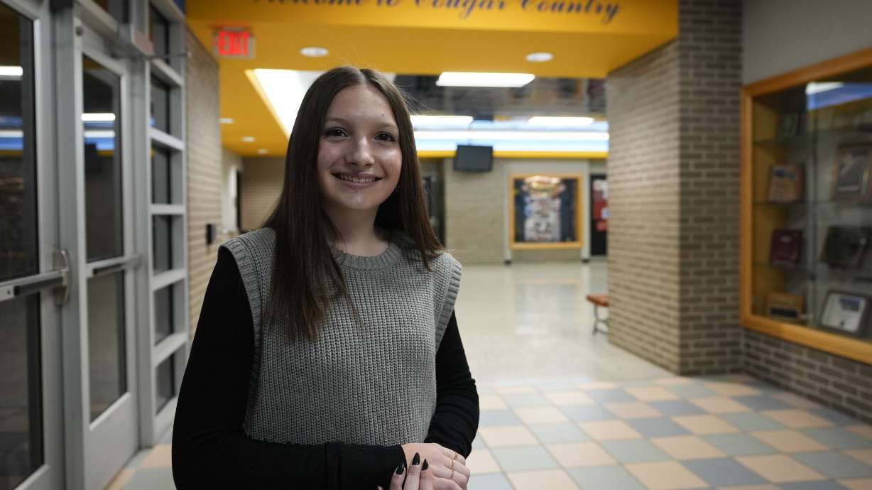 Makenzie Gilkison stands in the main lobby at Greenfield Central High School, Dec. 17 in Greenfield, Ind. Artificial intelligence holds the promise of helping countless students with impairments.