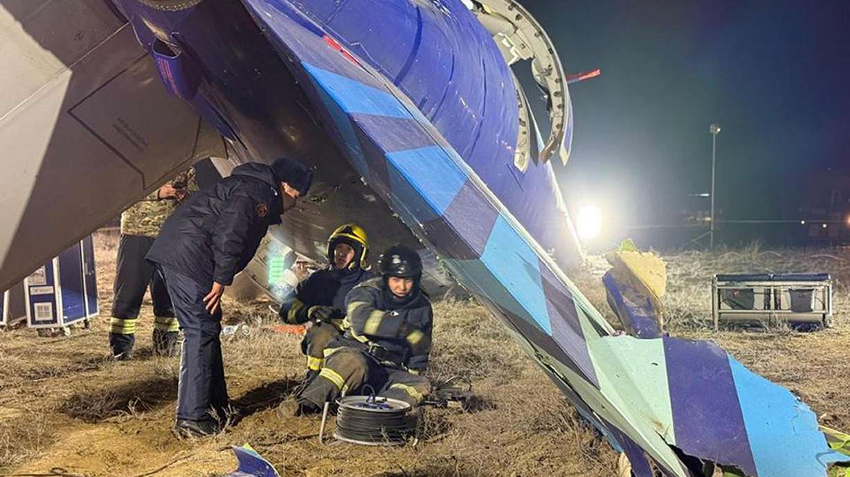 In this photo released by Kazakhstan's Emergency Ministry Press Service, rescuers work at the wreckage of Azerbaijan Airlines Embraer 190 lies on the ground near the airport of Aktau, Kazakhstan on Thursday.