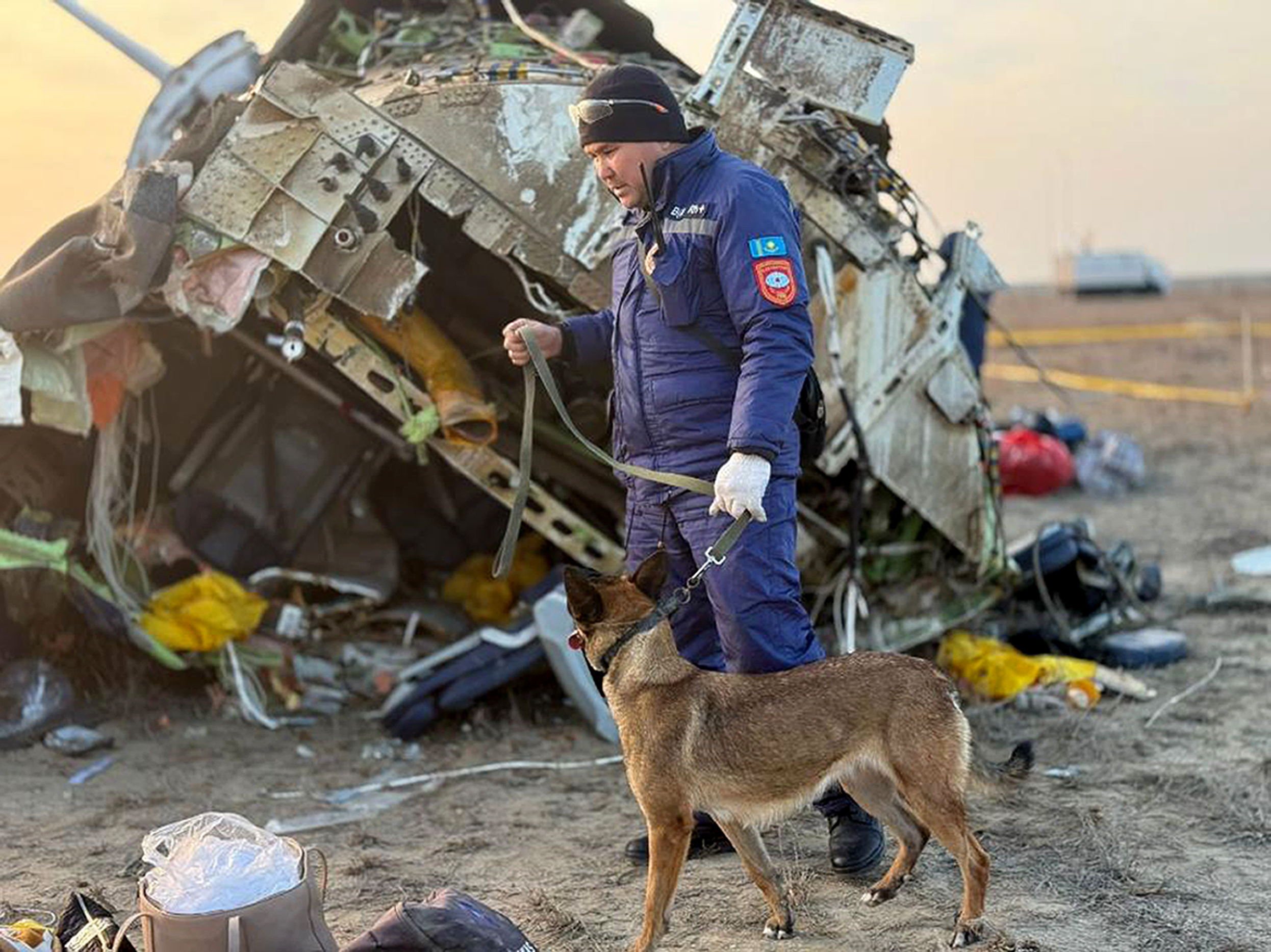 Rescuers work at the wreckage of Azerbaijan Airlines Embraer 190 that lays on the ground near the airport of Aktau, Kazakhstan, Thursday after it crashed on Wednesday.