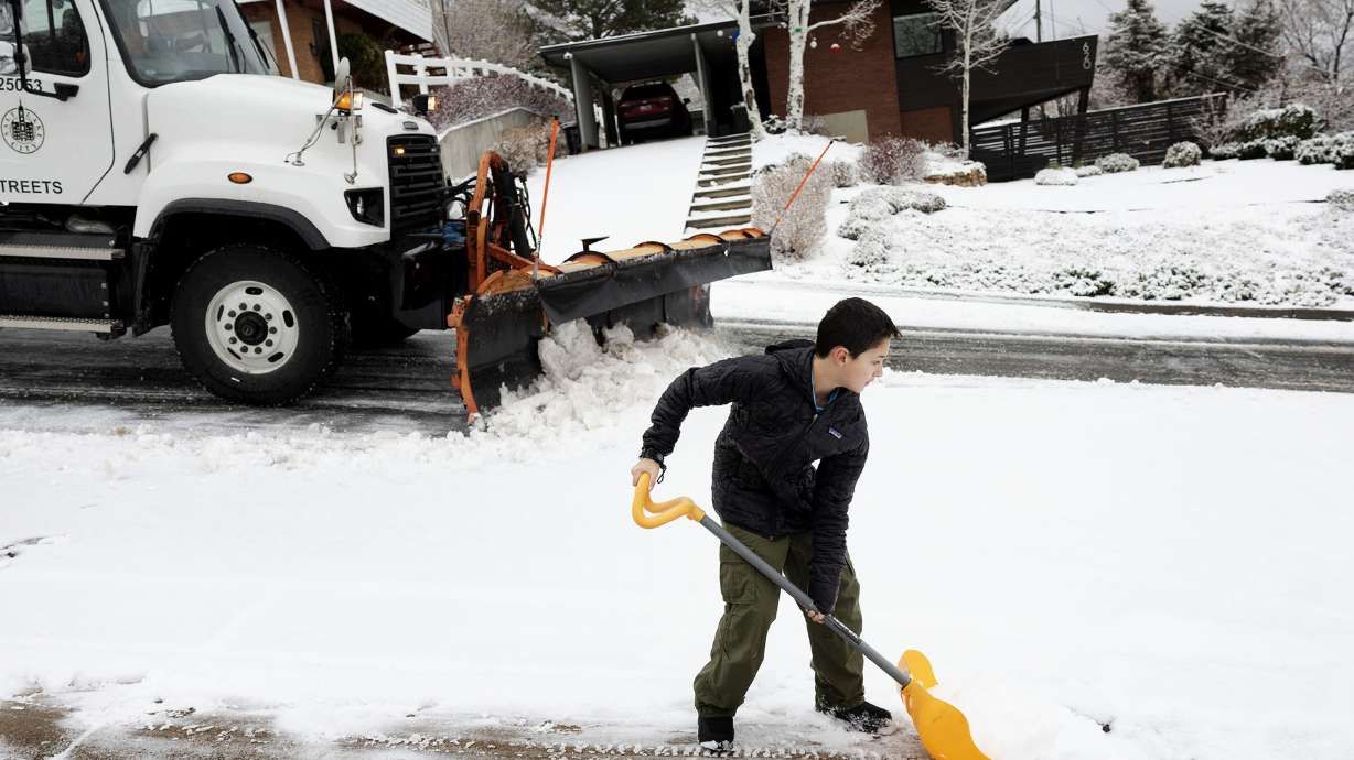 Sam Henriques, 10, shovels his driveway in Salt Lake City on Thursday. An active weather pattern will usher in rounds of rain and snow for the valleys and mountains of northern Utah over the course of the next four days.