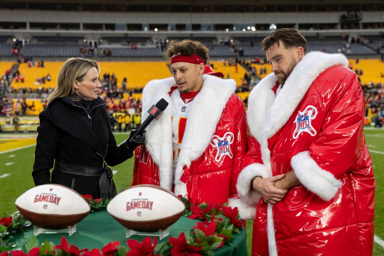 Netflix reporter Stacey Dales interviews Kansas City Chiefs quarterback Patrick Mahomes (15) and tight end Travis Kelce (87) after an NFL football game, Wednesday, in Pittsburgh.