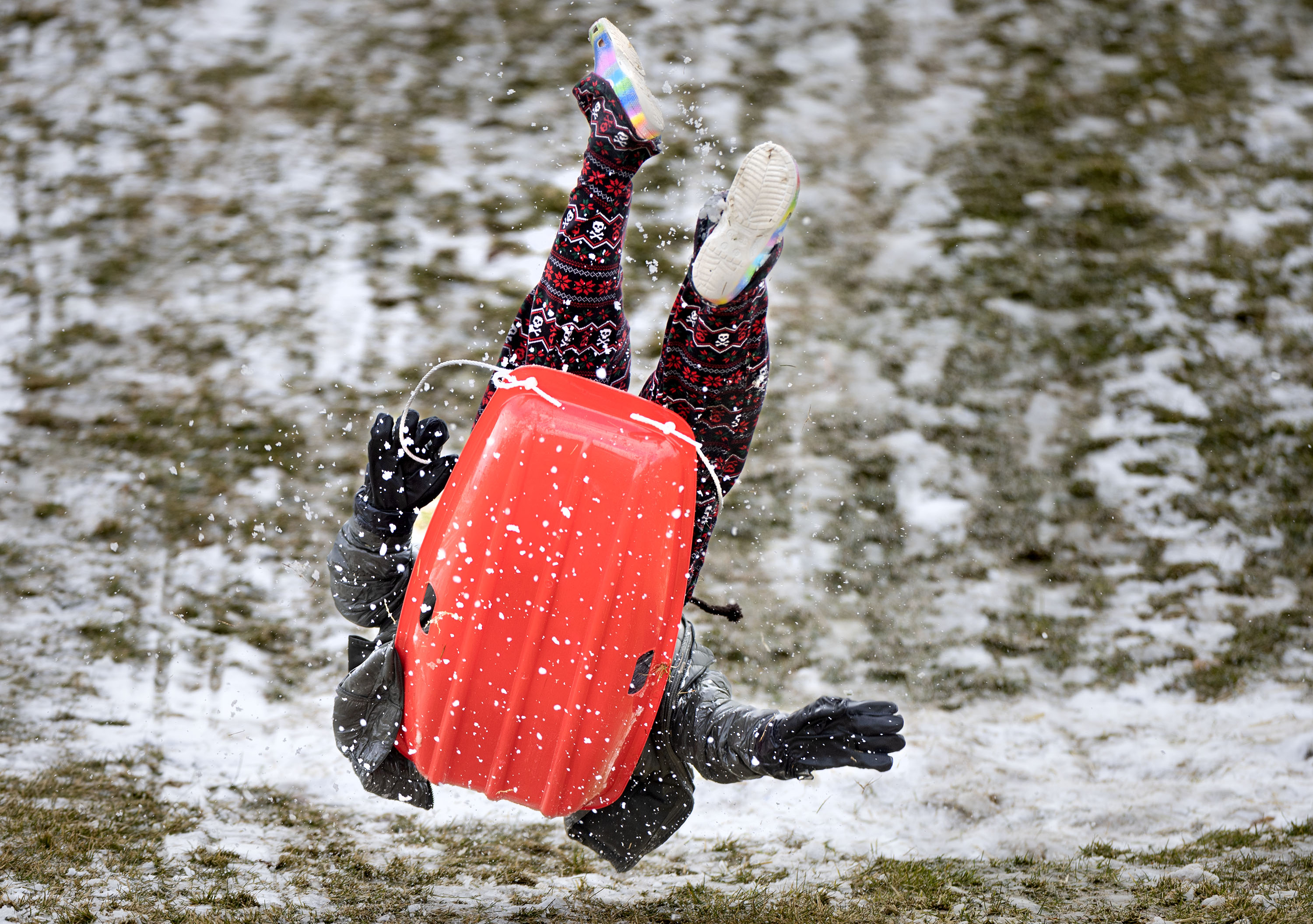 A boy catches air while sledding on the remnants of the morning’s snowfall at Sugar House Park in Salt Lake City on Thursday. An active weather pattern will usher in rounds of rain and snow for the valleys and mountains of northern Utah over the course of the next four days.