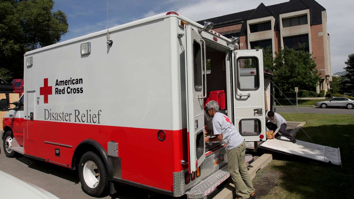 Red Cross workers Olivia Moreton and Ulysses Ramirez load a Red Cross vehicle with supplies on Aug. 27, 2008. The local Red Cross has received up to a $25,000 donation to help workers serve the community in various ways.