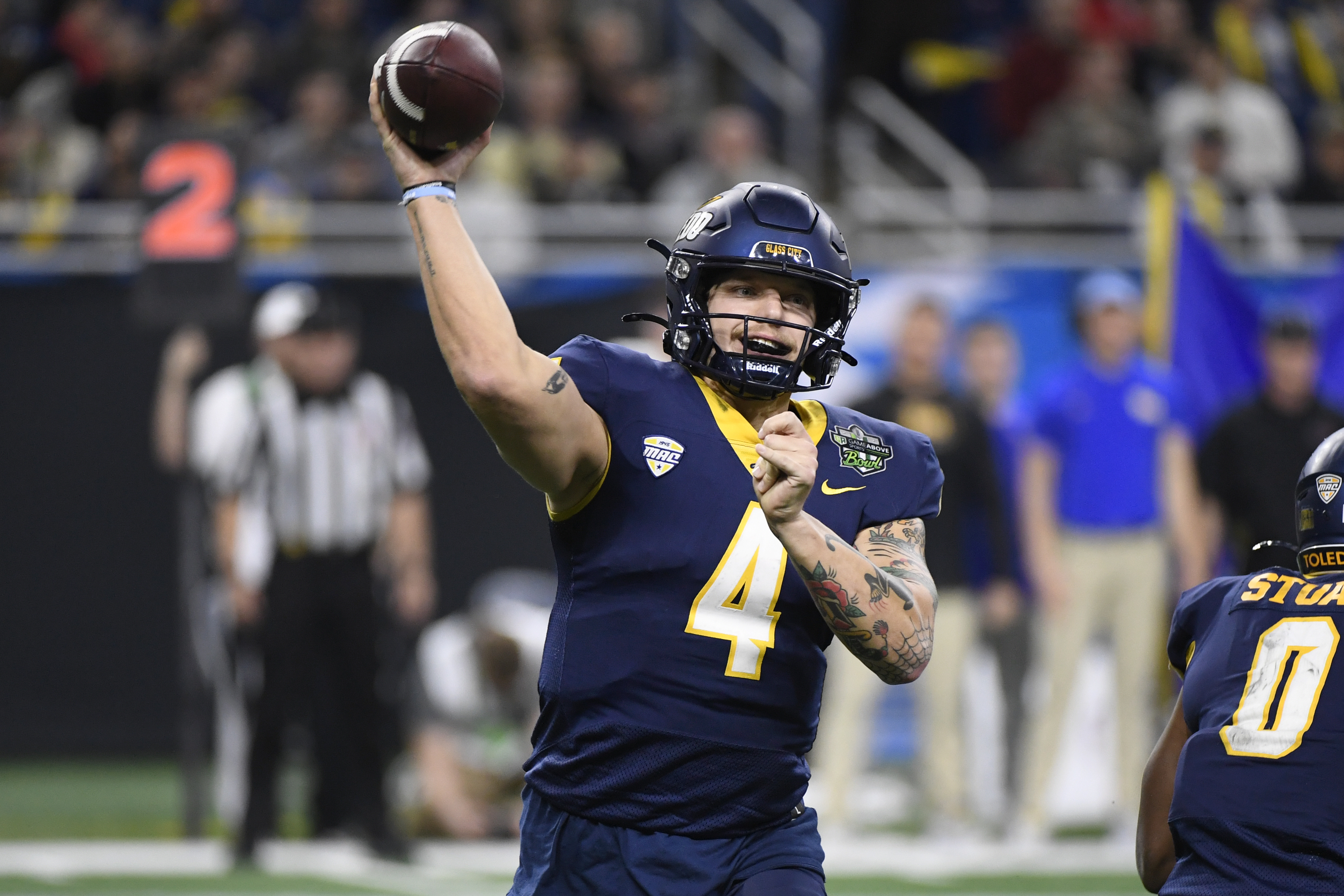 Toledo quarterback Tucker Gleason (4) throws against Pittsburgh during the first half of the GameAbove Sports Bowl NCAA college football game, Thursday, Dec. 26, 2024, in Detroit.
