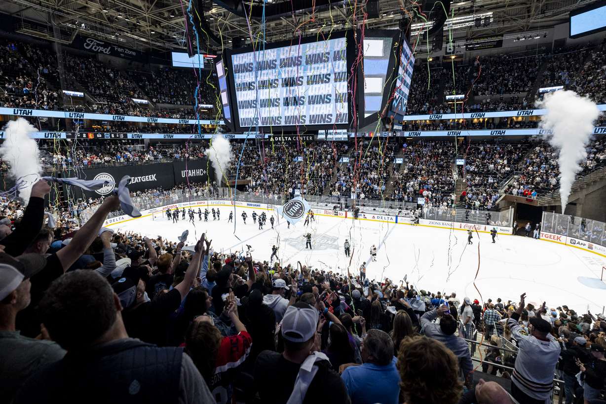 Fans celebrate after the Utah Hockey Club defeated the Chicago Blackhawks after a game held at the Delta Center in Salt Lake City on Oct. 8.