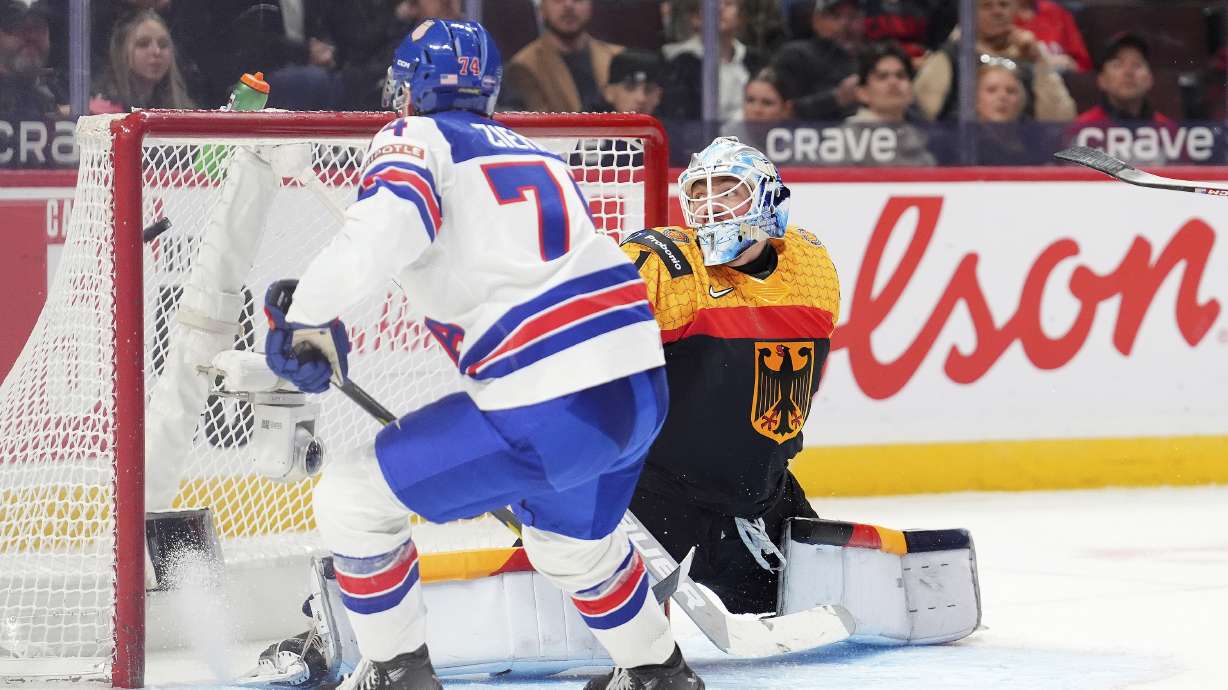 USA forward Brodie Ziemer (74) gets the puck past to score on Germany goaltender Nico Pertuch (1) during third period IIHF World Junior Hockey Championship preliminary round action in Ottawa on Thursday, Dec. 26, 2024.