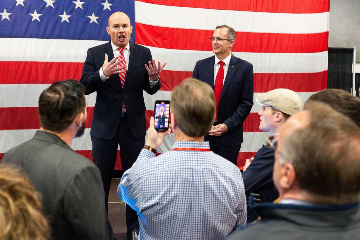 Sen. Mike Lee, R-Utah, campaigns with Colby Jenkins, running for the 2nd Congressional District, in the expo hall during the Utah Republican Party state nominating convention at the Salt Palace Convention Center in Salt Lake City, April 27.