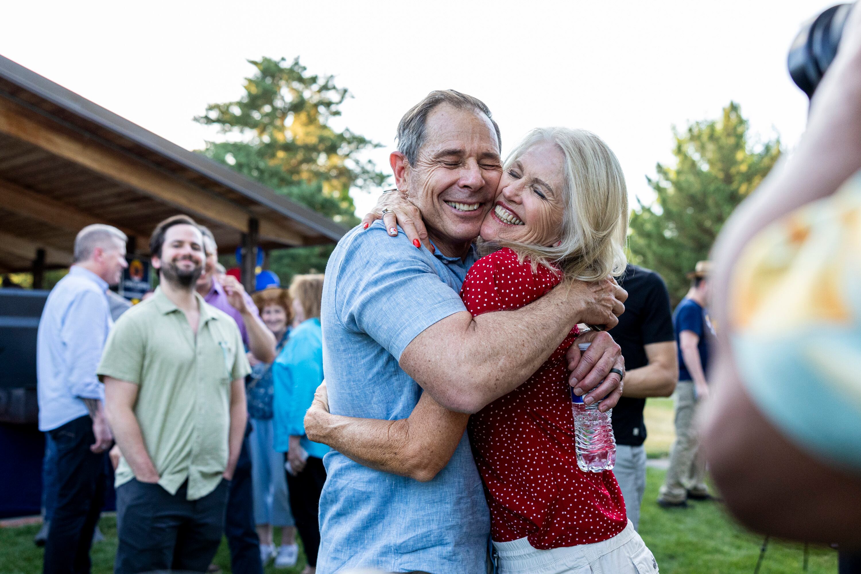 Senator-elect John Curtis hugs his wife, Sue, during a watch party for Curtis’ campaign held at Riverview Park in Provo on June 25.