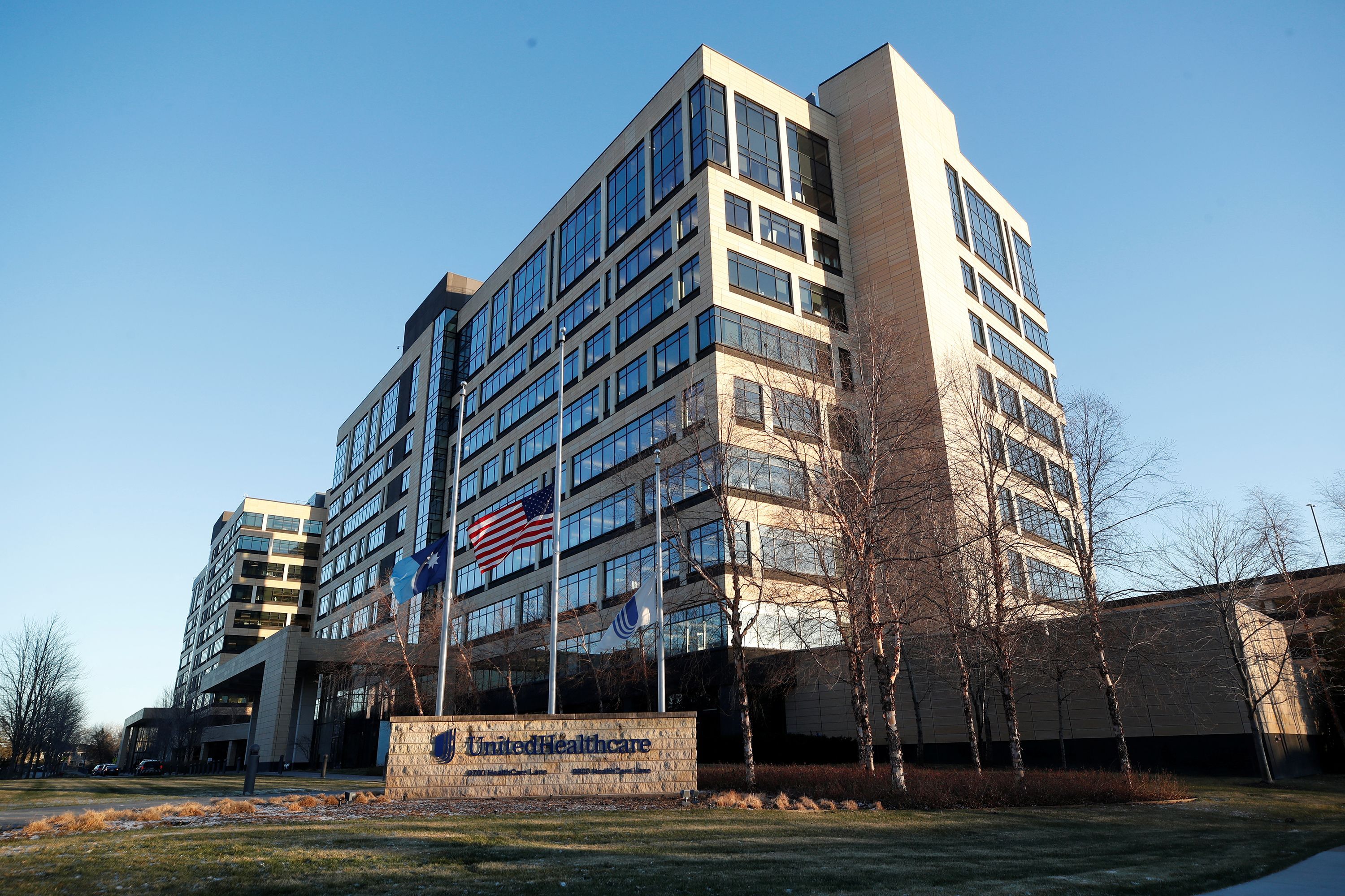 Flags fly at half-staff outside of the office of UnitedHealthcare, the day after the CEO of UnitedHealthcare Brian Thompson was shot dead, in Minnetonka, Minnesota, on Dec. 5.