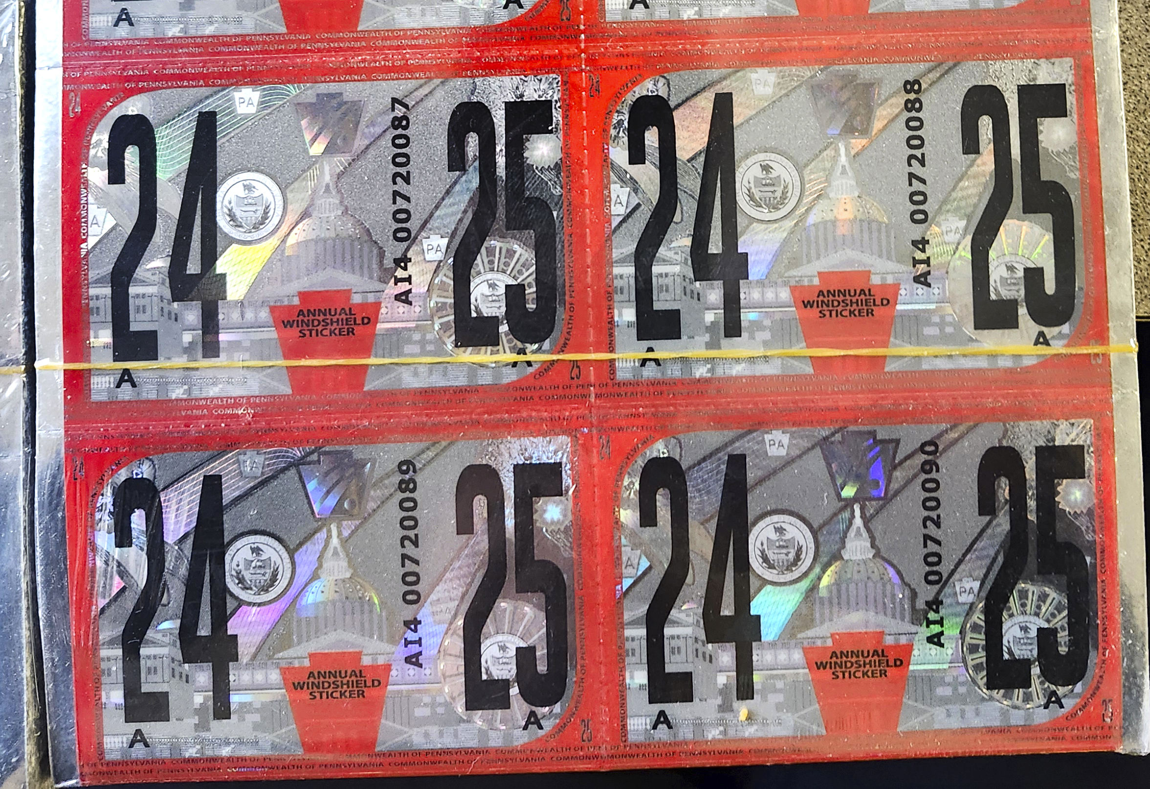 Counterfeit Pennsylvania vehicle inspection stickers are shown.