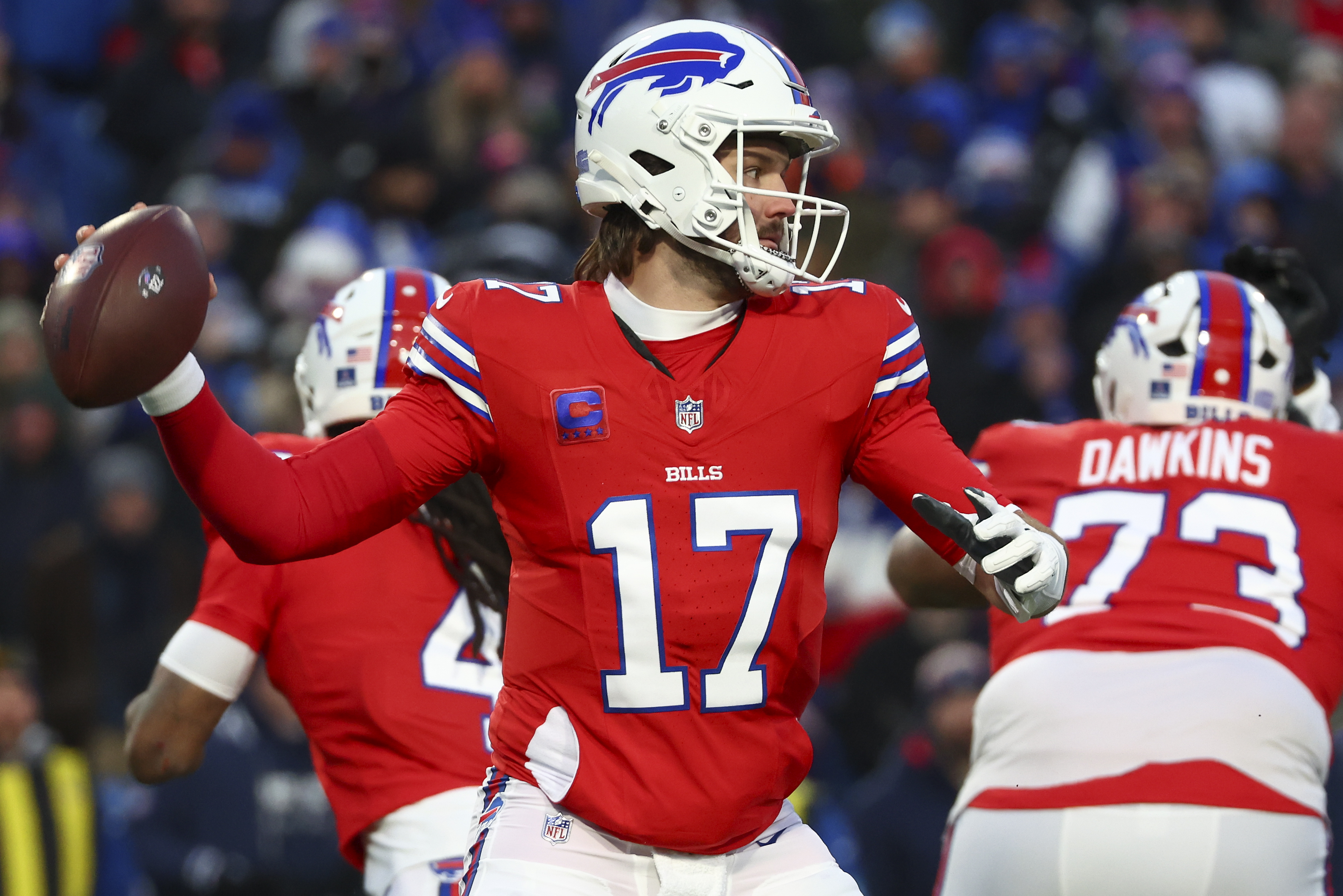 Buffalo Bills quarterback Josh Allen (17) passes against the New England Patriots during the first quarter of an NFL football game, Sunday, Dec. 22, 2024, in Orchard Park, N.Y..
