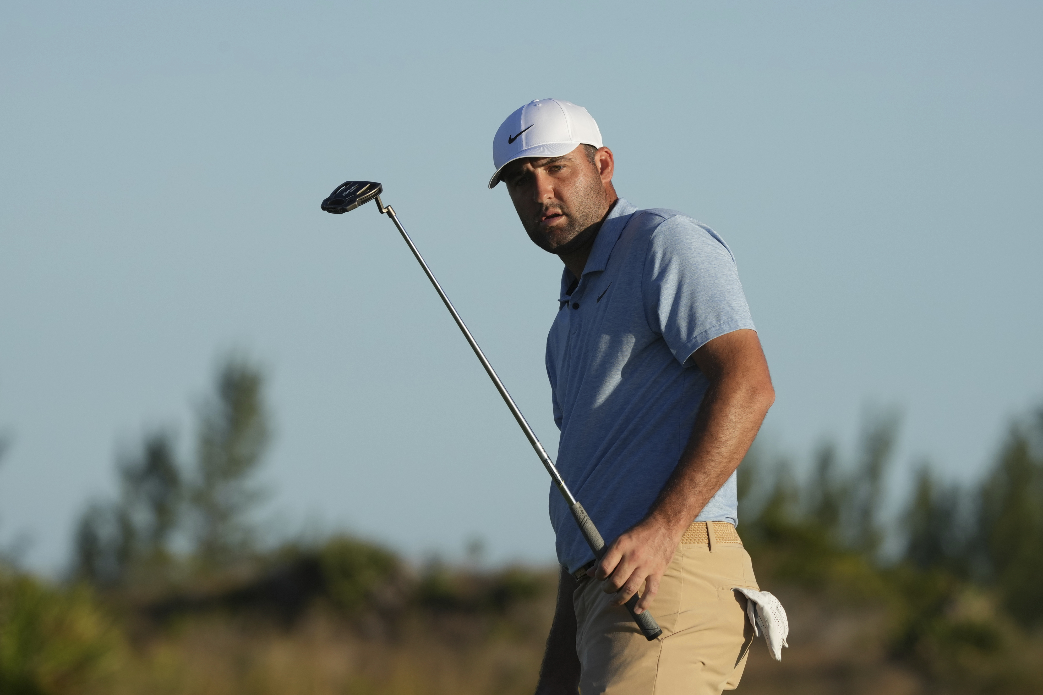 Scottie Scheffler, of the United States, watches his putt on the 17th green during the final round of the Hero World Challenge PGA Tour at the Albany Golf Club in New Providence, Bahamas, Sunday, Dec. 8, 2024.