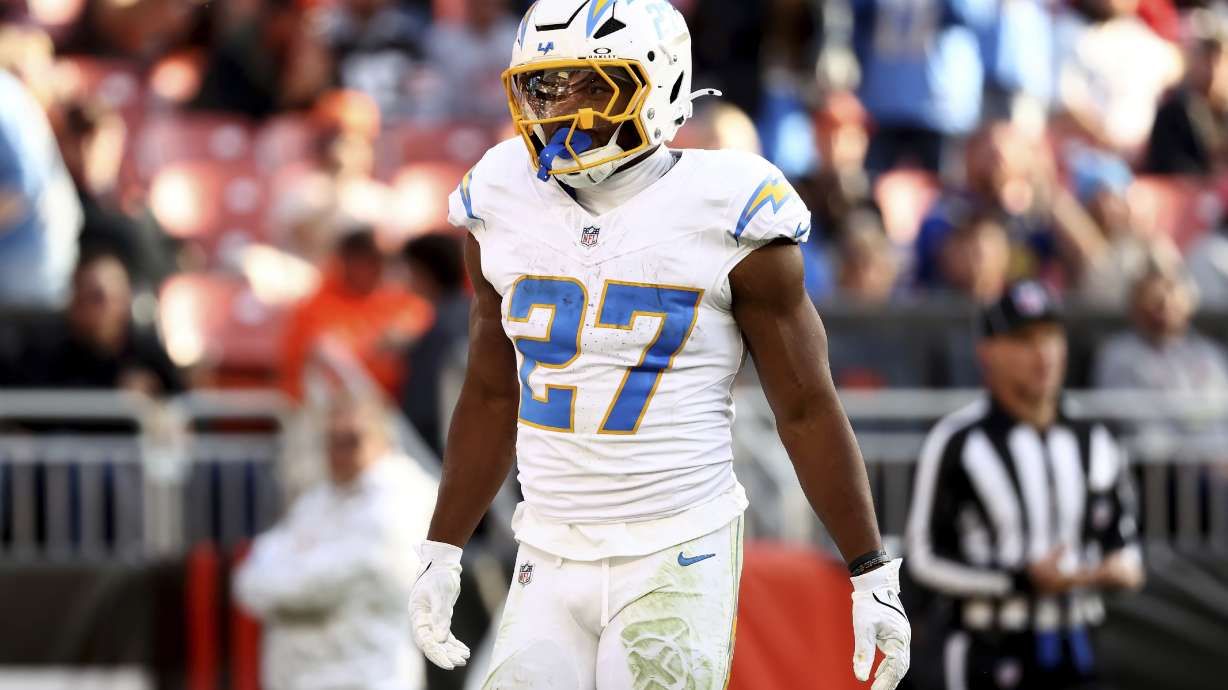 FILE -Los Angeles Chargers running back J.K. Dobbins (27) reacts after gaining a first down during an NFL football game against the Cleveland Browns, Sunday, Nov. 3, 2024, in Cleveland.