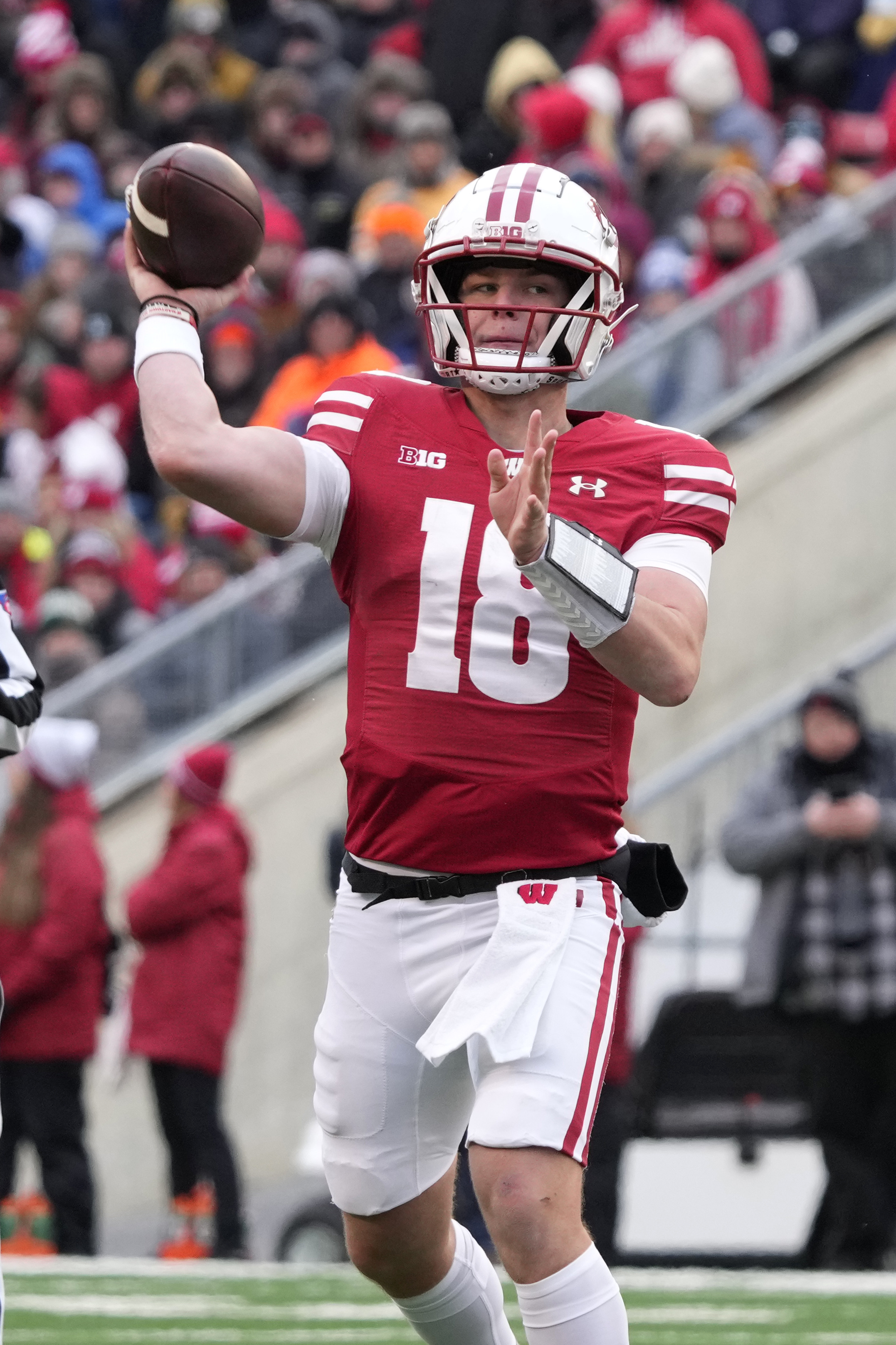 Wisconsin quarterback Braedyn Locke looks to throw a pass during the second half of an NCAA college football game against Minnesota, Friday, Nov. 29, 2024, in Madison, Wis.