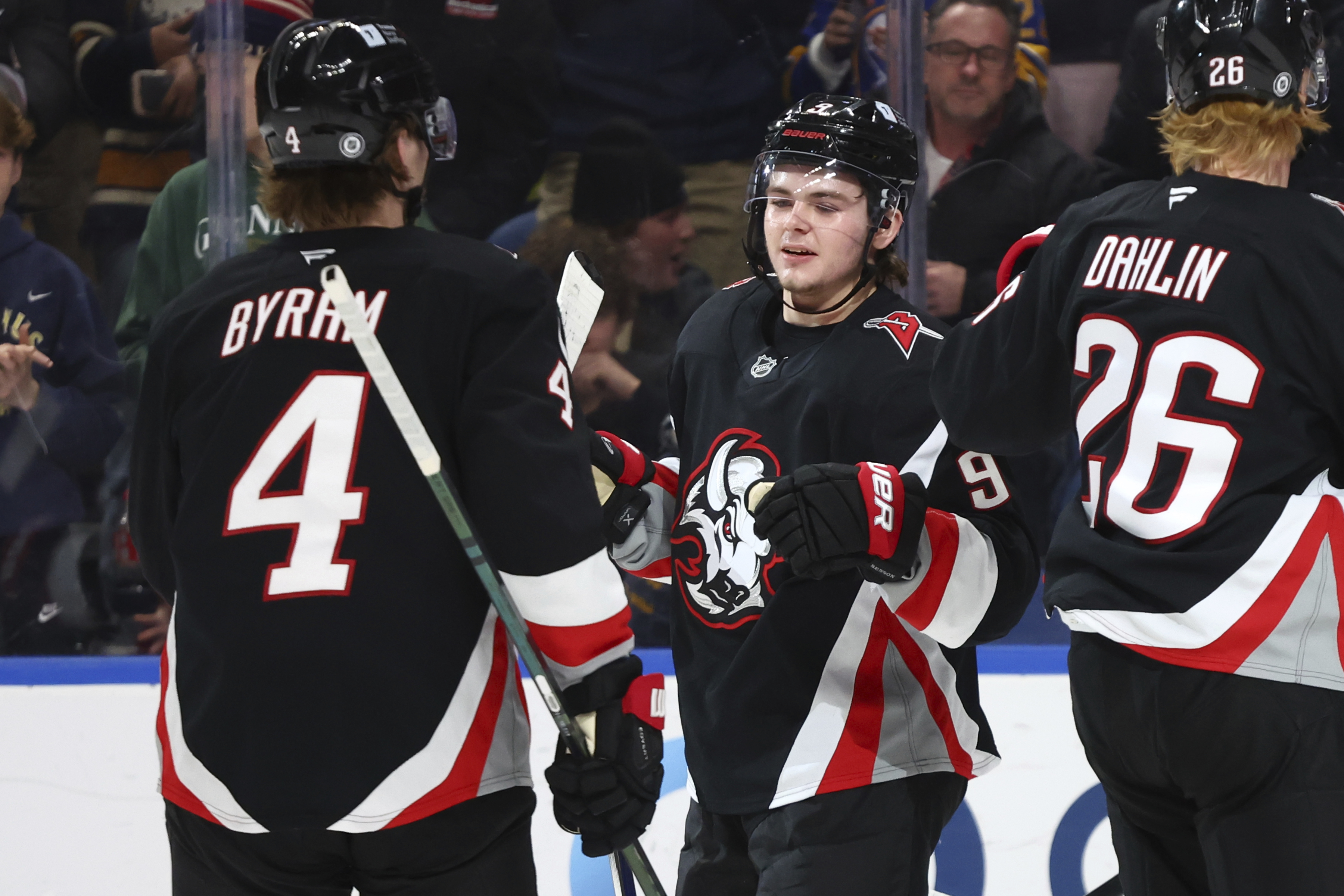 Buffalo Sabres left wing Zach Benson (9) celebrates his goal with defenseman Bowen Byram (4) during the first period of an NHL hockey game against the Chicago Blackhawks Friday, Dec. 27, 2024, in Buffalo, N.Y. 