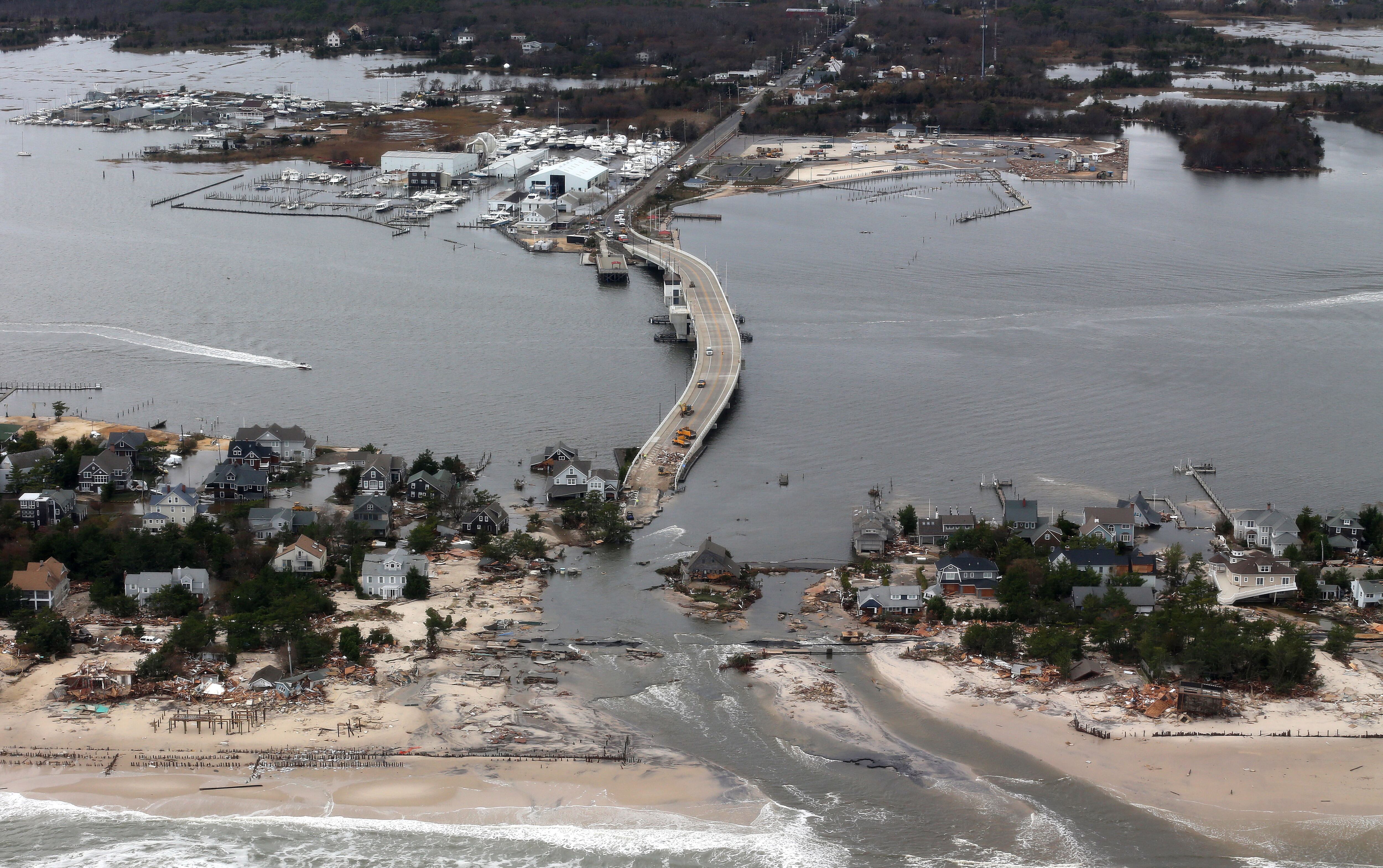 This Oct. 31, 2012, file aerial photo shows storm damage from Hurricane Sandy over the Atlantic Coast in Mantoloking, N.J.