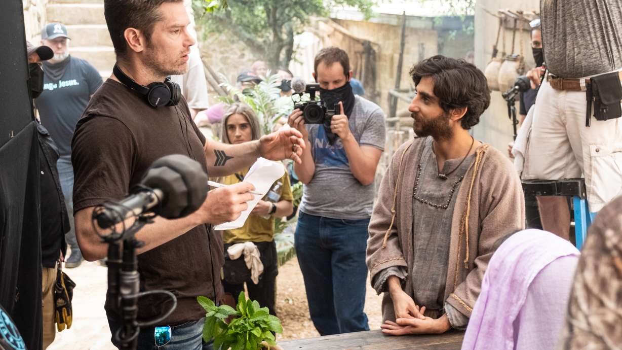 Dallas Jenkins, creator and director of “The Chosen,” left, talks with actor Luke Dimyan, who plays Judas, while filming a scene from Season 3.