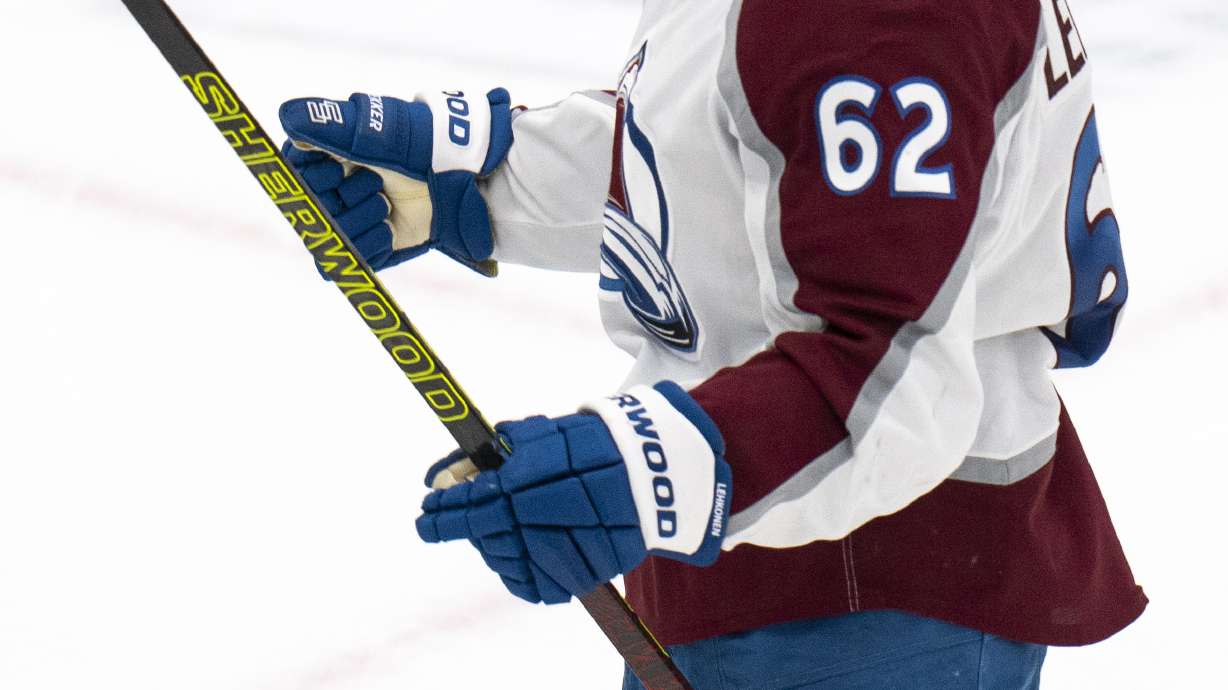 Colorado Avalanche left wing Artturi Lehkonen reacts after scoring a goal during the third period of an NHL hockey game against the Utah Hockey Club, Friday, Dec. 27, 2024, in Salt Lake City.