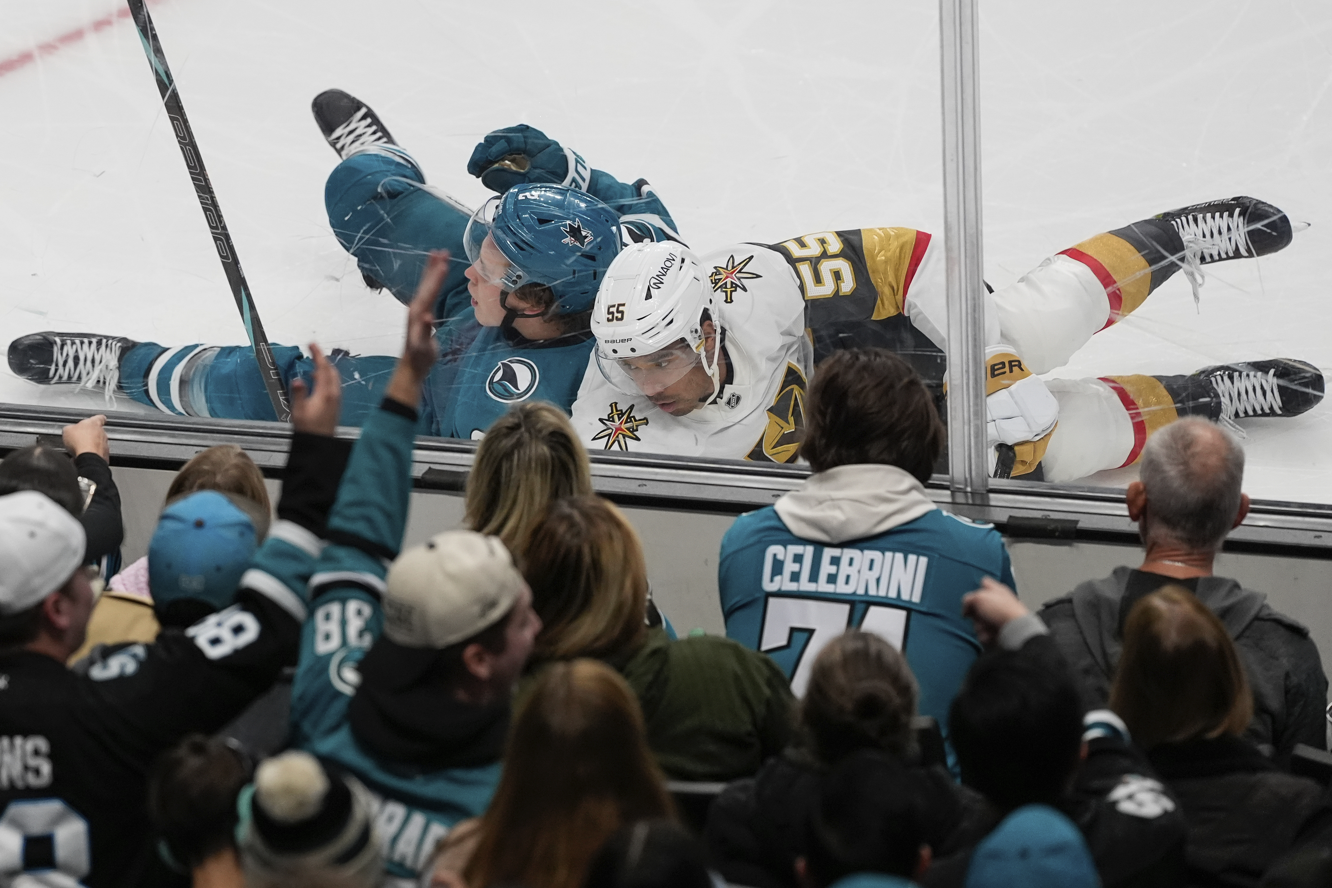 San Jose Sharks center Will Smith, top left, and Vegas Golden Knights right wing Keegan Kolesar (55) collide during the second period of an NHL hockey game, Friday, Dec. 27, 2024, in San Jose, Calif.