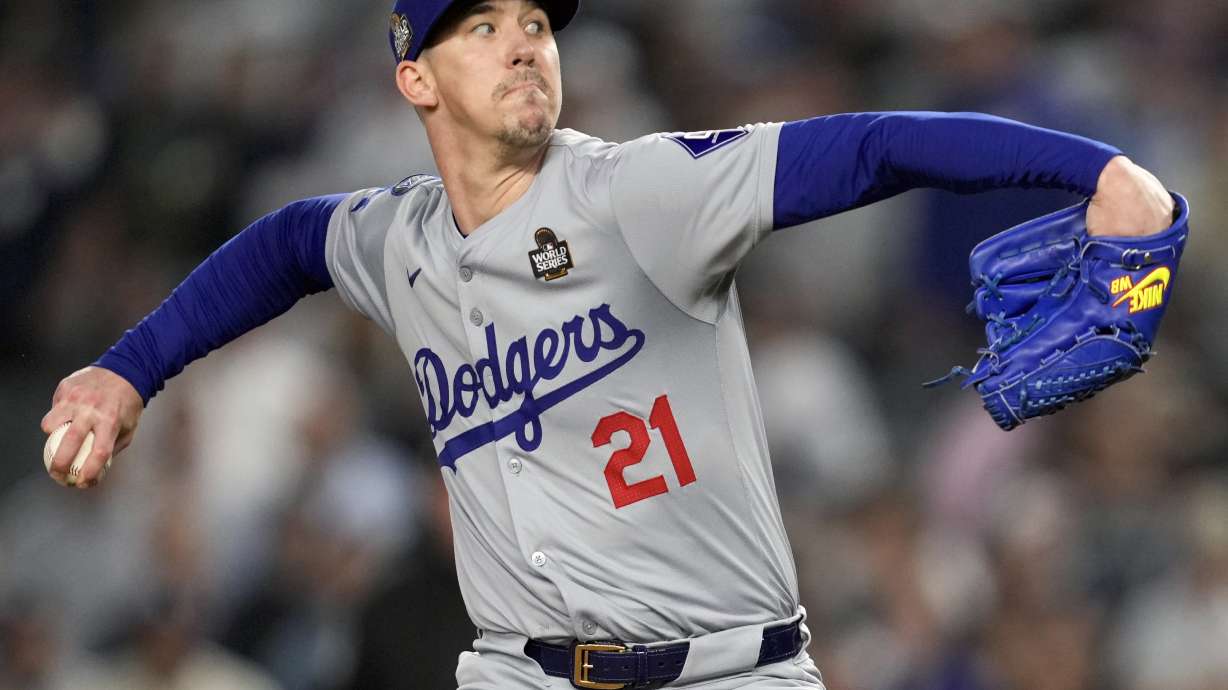 FILE - Los Angeles Dodgers pitcher Walker Buehler throws against the New York Yankees during the ninth inning in Game 5 of the baseball World Series, Oct. 30, 2024, in New York.