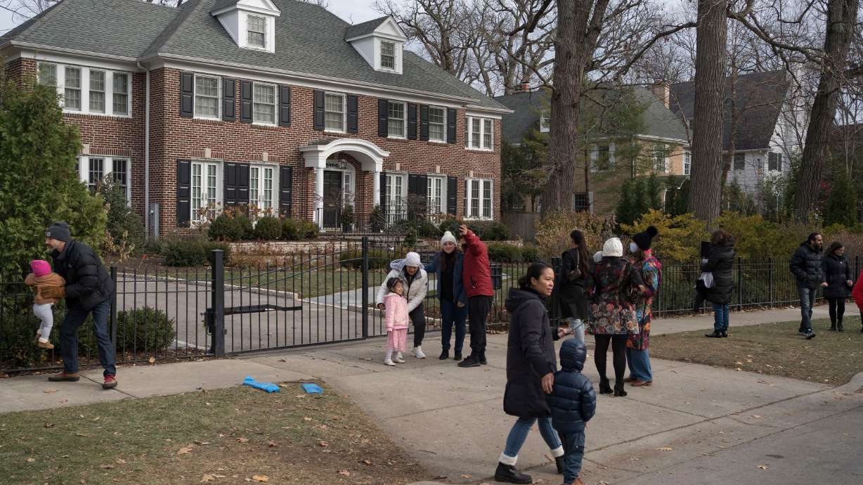 People visit the house featured in the movie "Home Alone" in Winnetka, Illinois on Nov. 27, 2021.