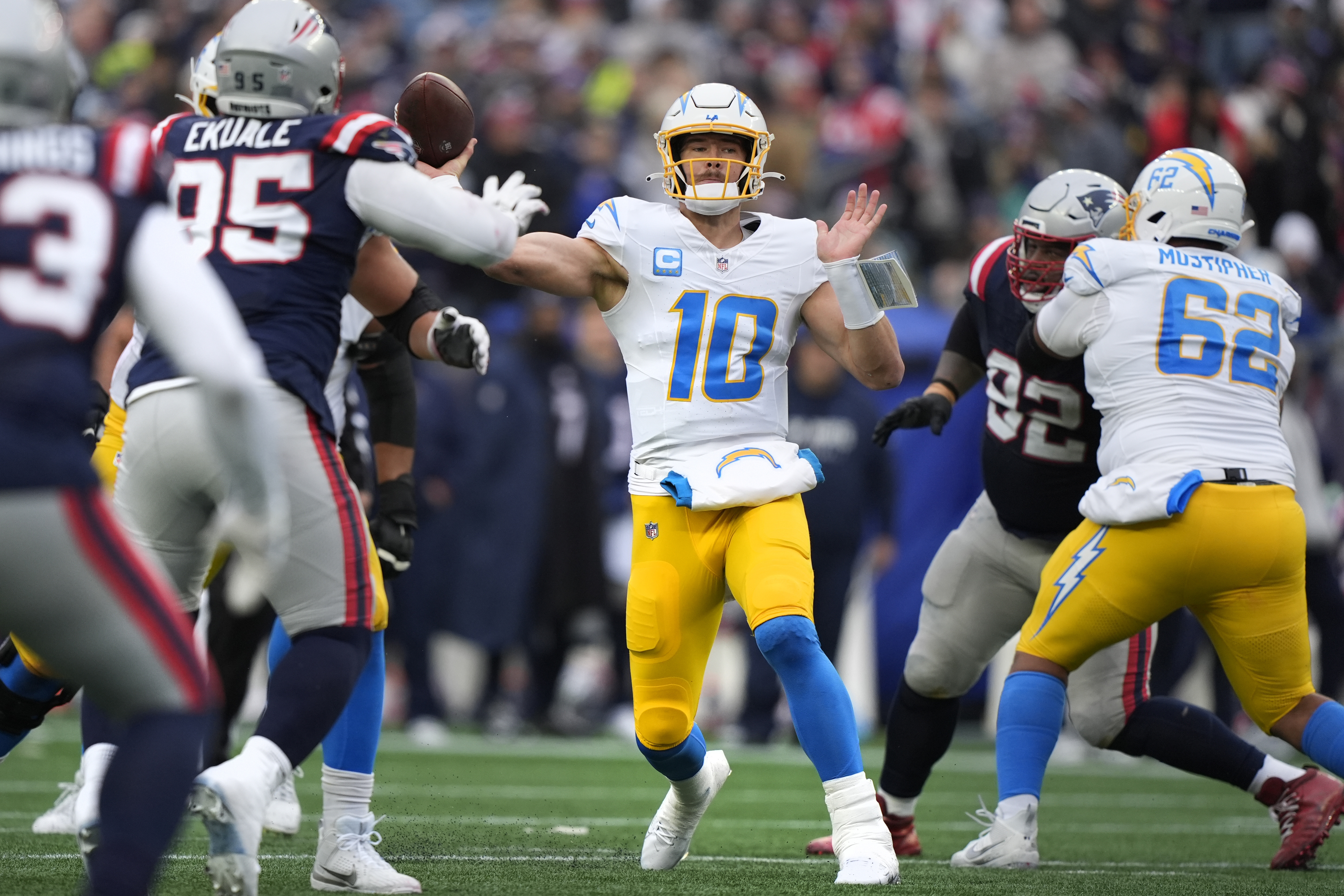Los Angeles Chargers quarterback Justin Herbert (10) throws a pass against the New England Patriots during the first half of an NFL football game, Saturday, Dec. 28, 2024, in Foxborough, Mass. 