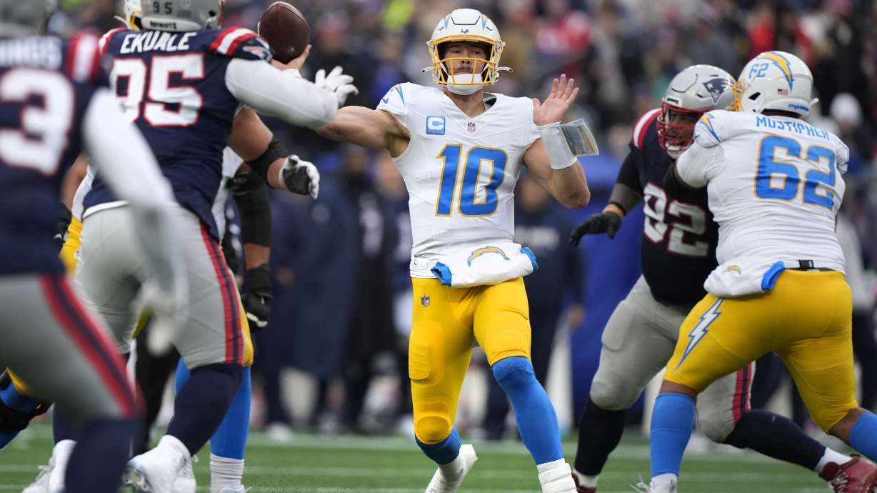 Los Angeles Chargers quarterback Justin Herbert (10) throws a pass against the New England Patriots during the first half of an NFL football game, Saturday, Dec. 28, 2024, in Foxborough, Mass.