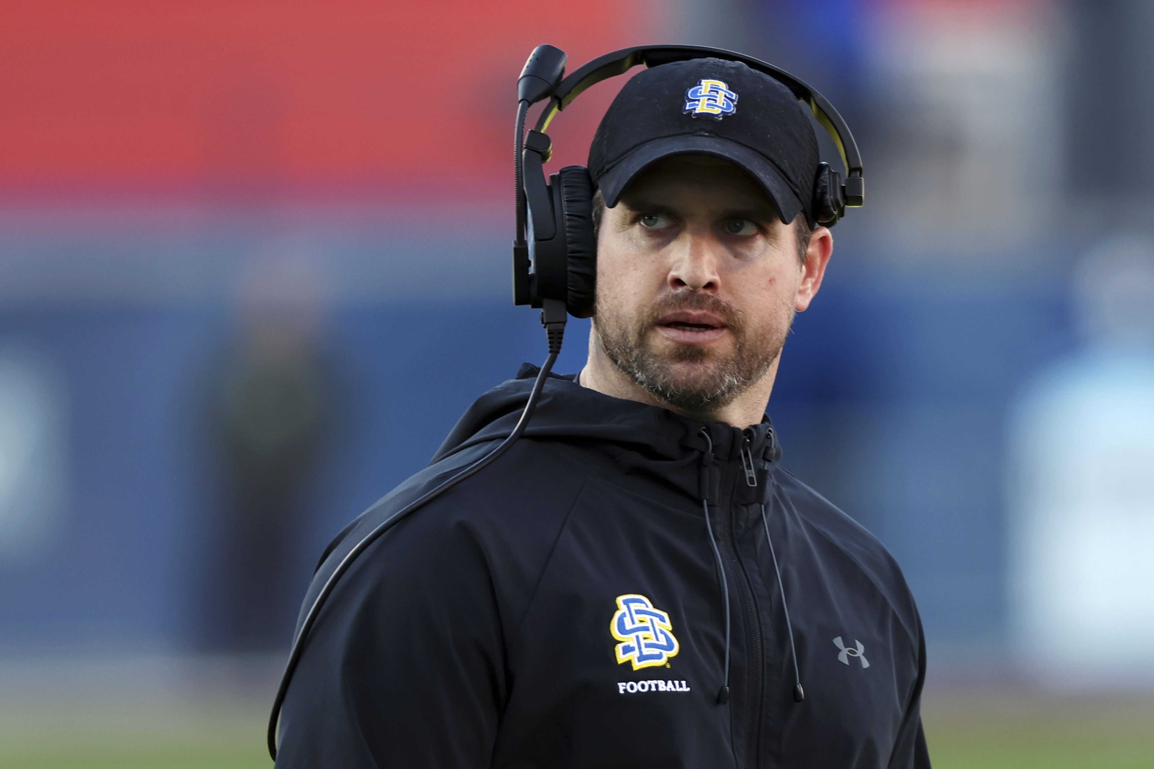 FILE - South Dakota State head coach Jimmy Rogers stands on the field at the FCS Championship NCAA college football game against Montana, Sunday, Jan. 7, 2024, in Frisco, Texas. 