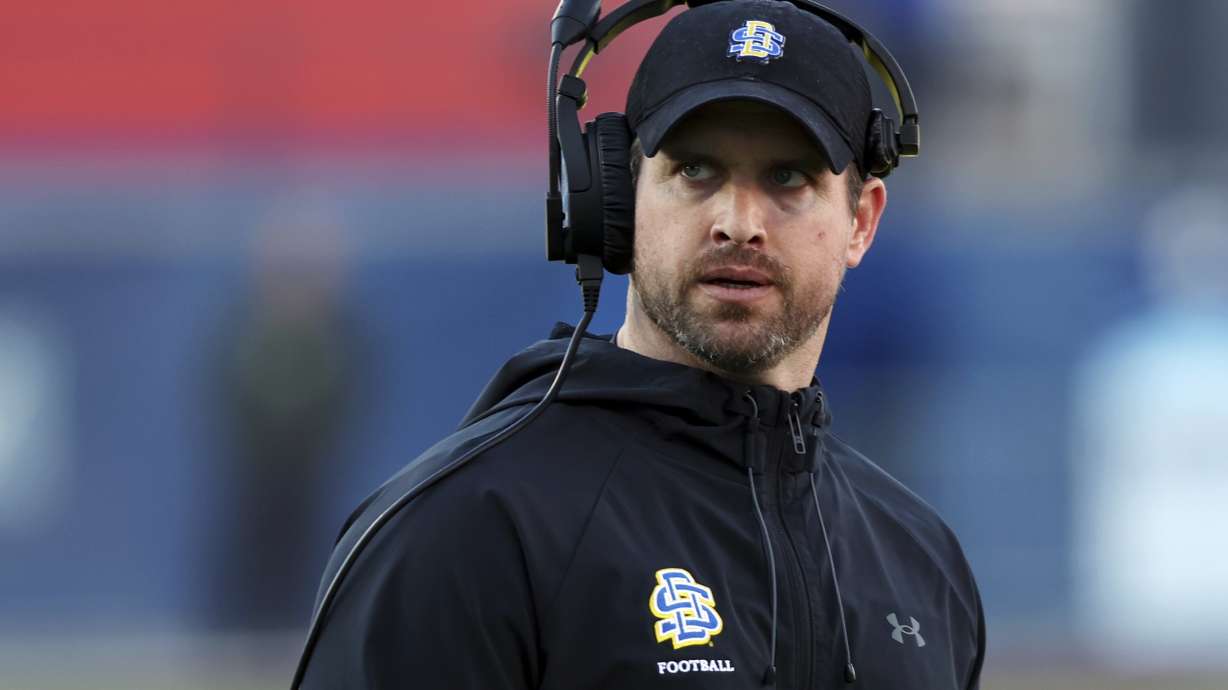 FILE - South Dakota State head coach Jimmy Rogers stands on the field at the FCS Championship NCAA college football game against Montana, Sunday, Jan. 7, 2024, in Frisco, Texas.