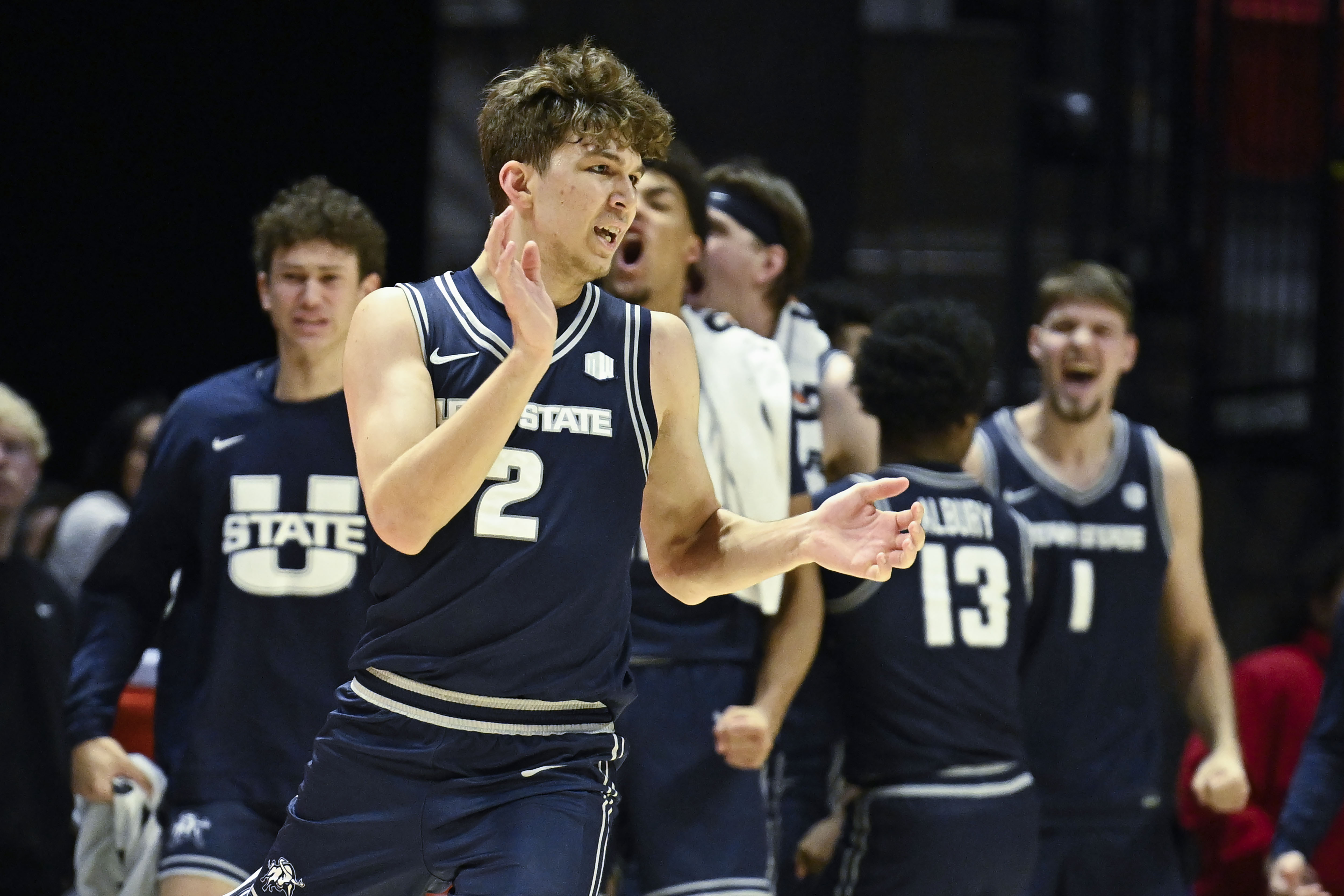 Utah State forward Tucker Anderson (2) celebrates after hitting a 3-point basket during the second half of an NCAA college basketball game against San Diego State, Saturday, Dec. 28, 2024, in San Diego.