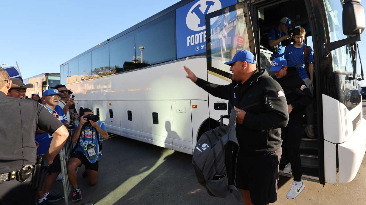 Brigham Young head coach Kalani Sitake and the BYU team arrive at the Valero Alamo Bowl in San Antonio on Saturday, Dec. 28, 2024.