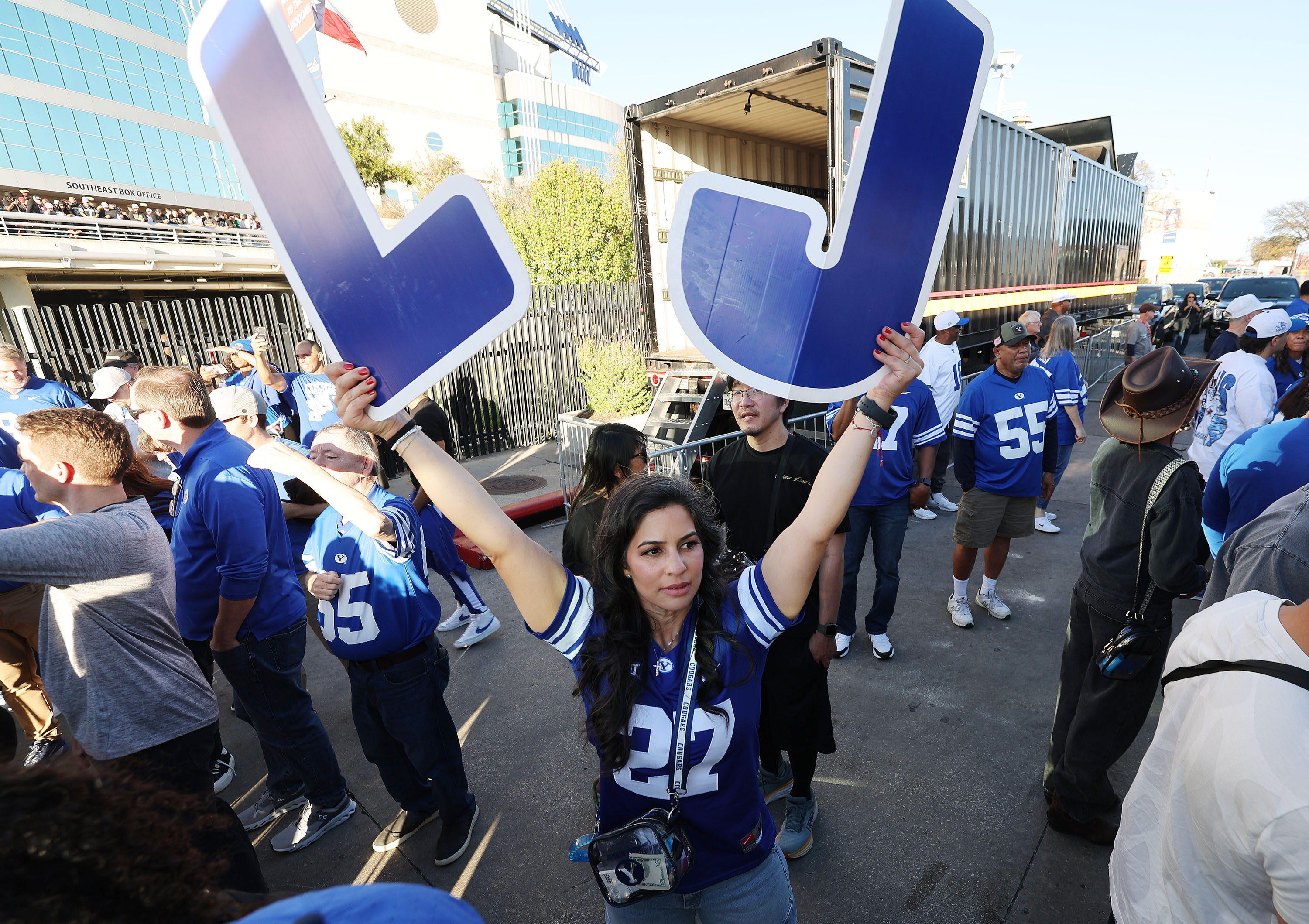 A sign is held for Brigham Young running back LJ Martin (27) as the team arrives at the Valero Alamo Bowl in San Antonio on Saturday, Dec. 28, 2024.