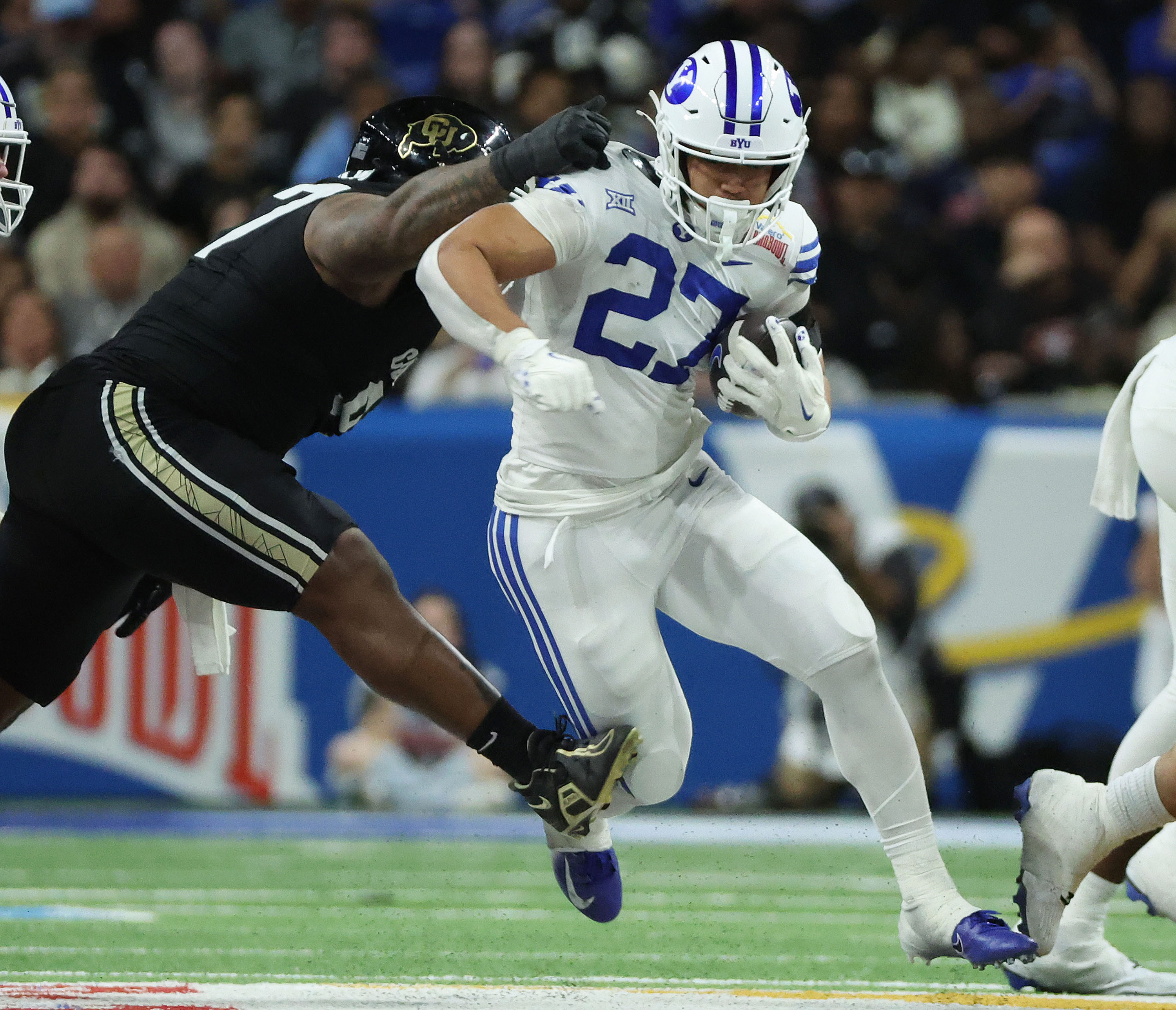 Brigham Young running back LJ Martin (27) runs during the Valero Alamo Bowl in San Antonio on Saturday, Dec. 28, 2024. BYU won 36-14.