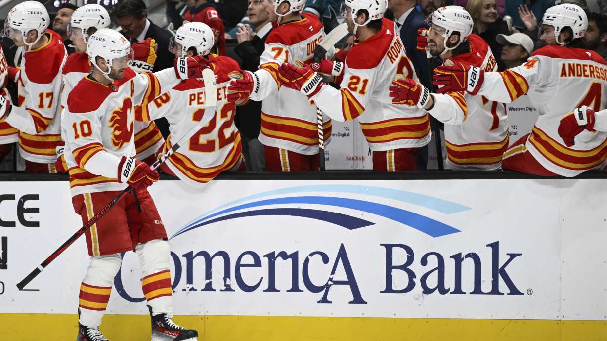 Calgary Flames center Jonathan Huberdeau (10) celebrates after his goal against the San Jose Sharks during the first period of an NHL hockey game Saturday, Dec. 28, 2024, in San Jose, Calif.