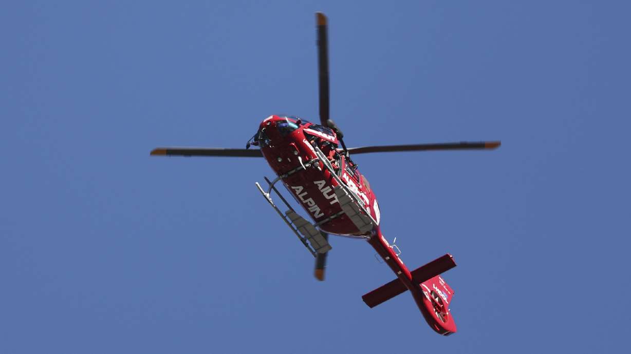 Emergencies helicopter takes Switzerland's Gino Caviezel to the hospital after his fall during an alpine ski, men's World Cup Super G race, in Bormio, Italy, Sunday, Dec. 29, 2024.
