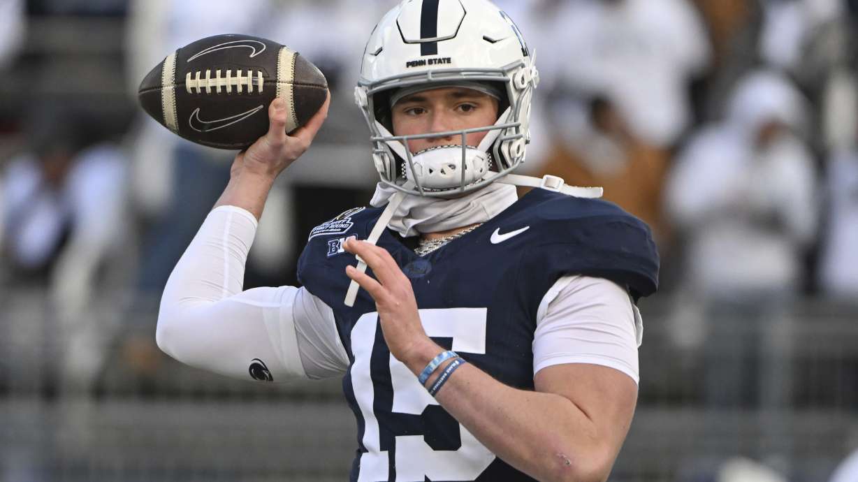 Penn State quarterback Drew Allar warms up for the game against SMU in the first round of the NCAA College Football Playoff, Saturday, Dec. 21, 2024, in State College, Pa.