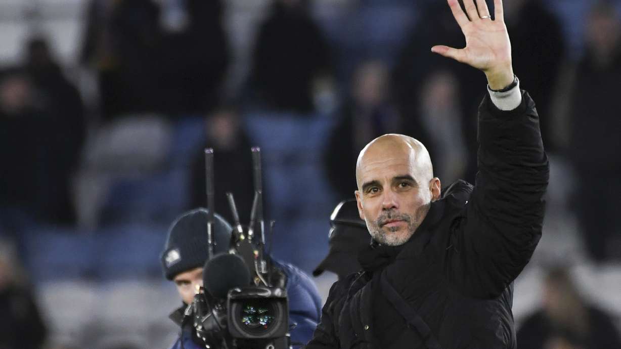 Manchester City's head coach Pep Guardiola greets fans at the end of the English Premier League soccer match between Leicester City and Manchester City at King Power stadium in Leicester, England, Sunday, Dec. 29, 2024.