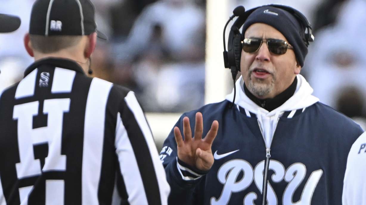 Penn State head coach James Franklin talks with an official during the second half against SMU in the first round of the College Football Playoff, Saturday, Dec. 21, 2024, in State College, Pa.