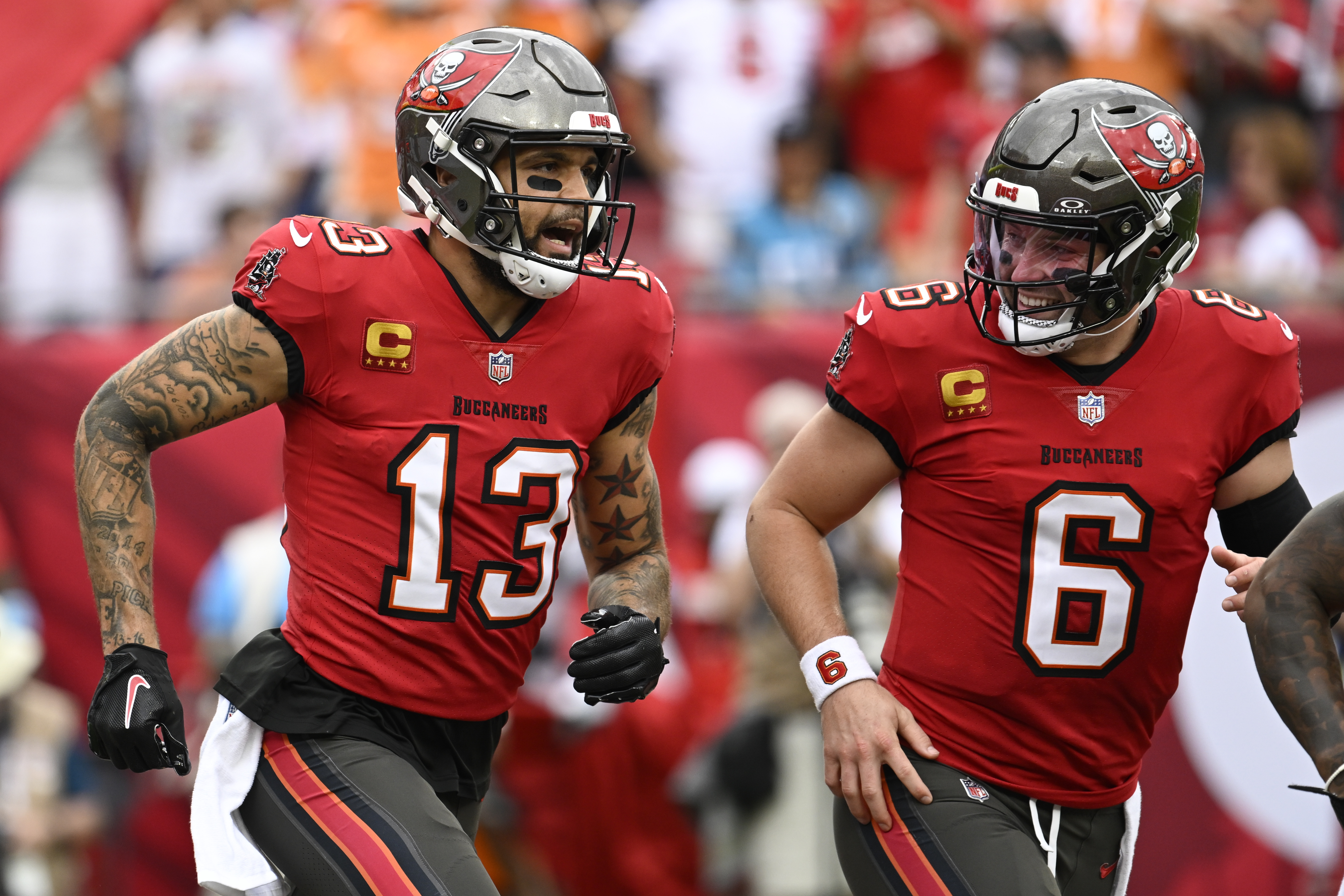 Tampa Bay Buccaneers wide receiver Mike Evans celebrates after scoring with quarterback Baker Mayfield against the Carolina Panthers during the first half of an NFL football game Sunday, Dec. 29, 2024, in Tampa, Fla.