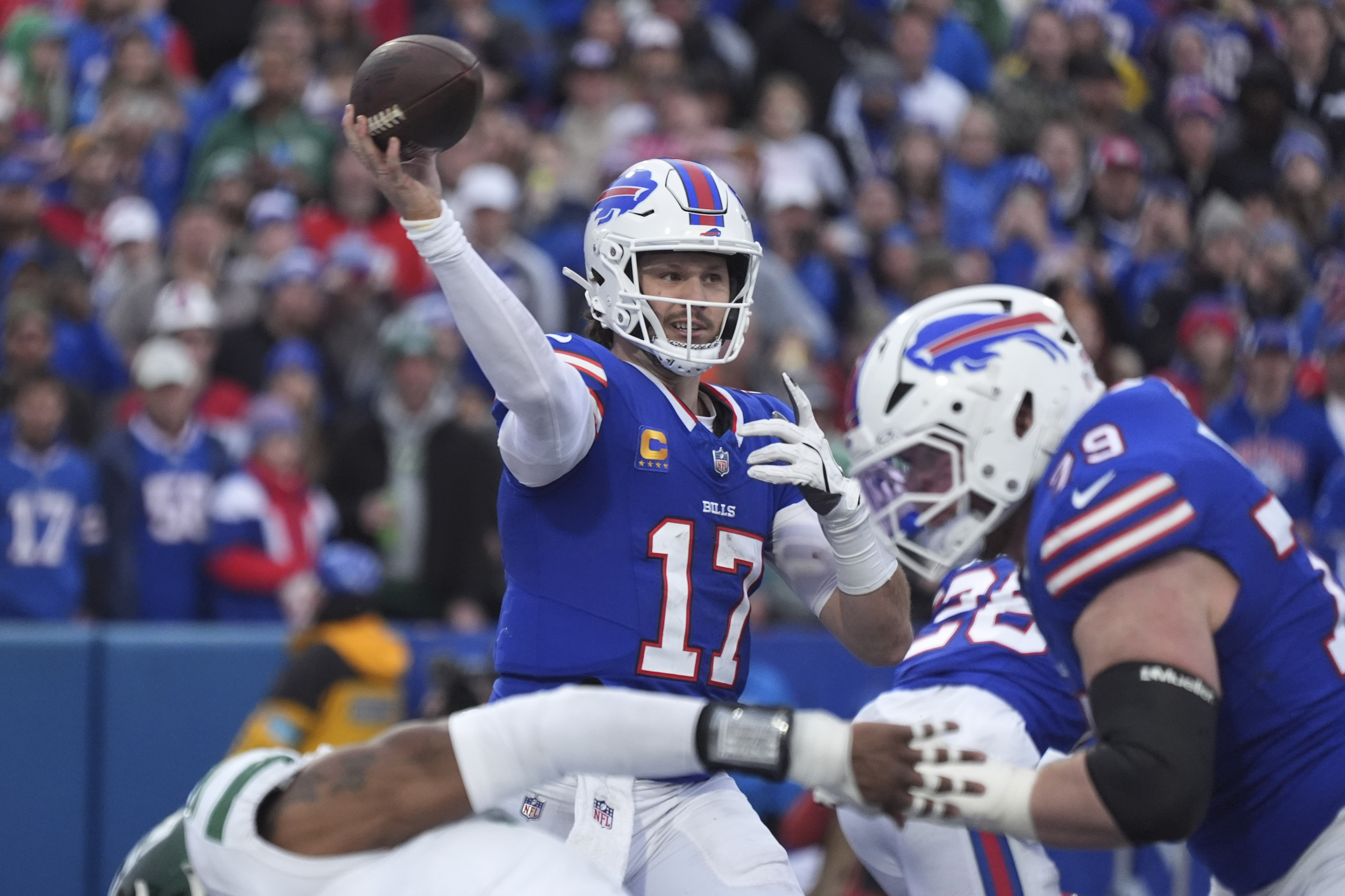 Bills clinch the AFC's No. 2 seed with a 40-14 rout of the undisciplined Jets