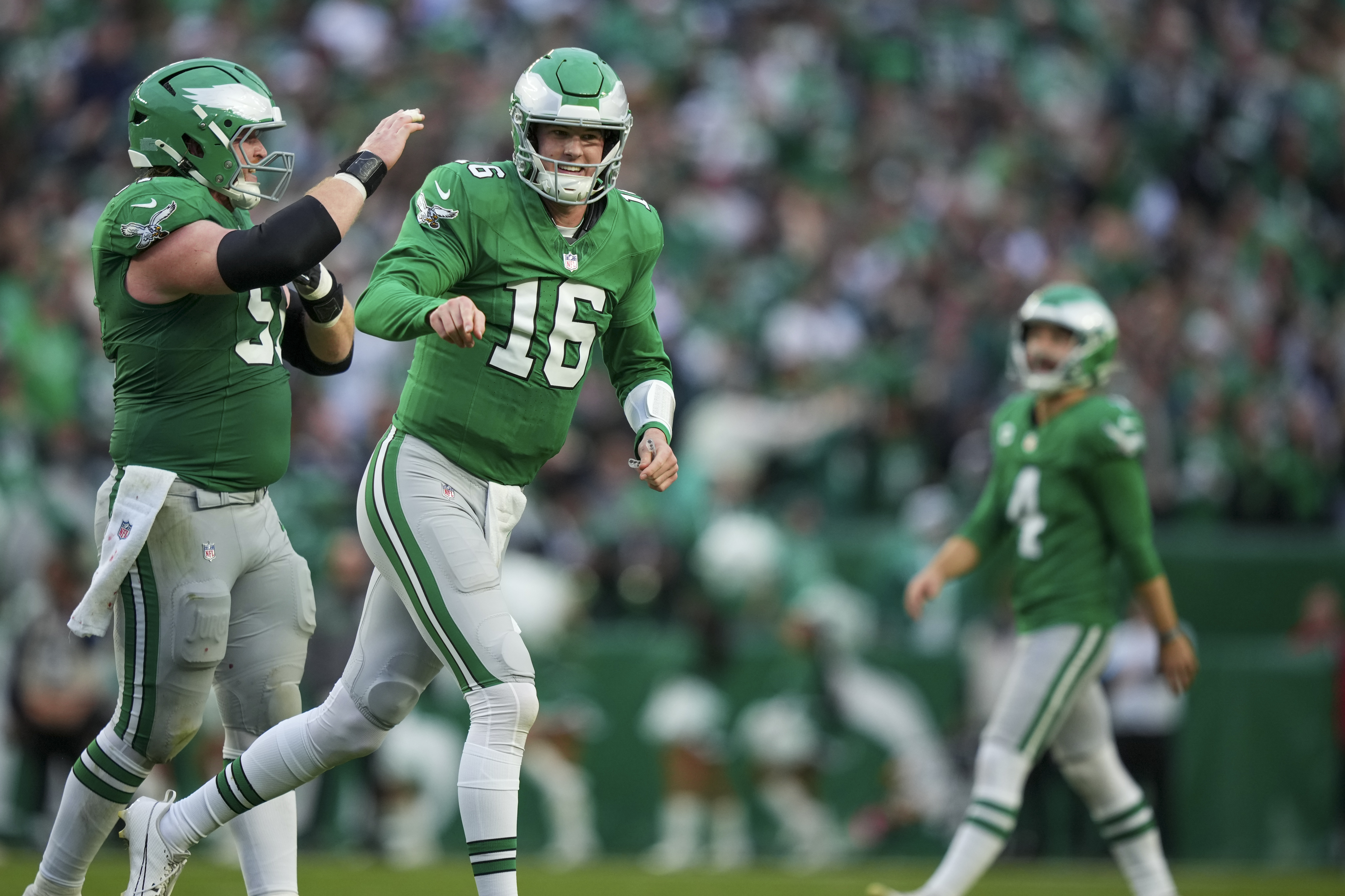 Philadelphia Eagles quarterback Tanner McKee (16) reacts after throwing a touchdown pass to wide receiver DeVonta Smith during the second half of an NFL football game against the Dallas Cowboys, Sunday, Dec. 29, 2024, in Philadelphia.