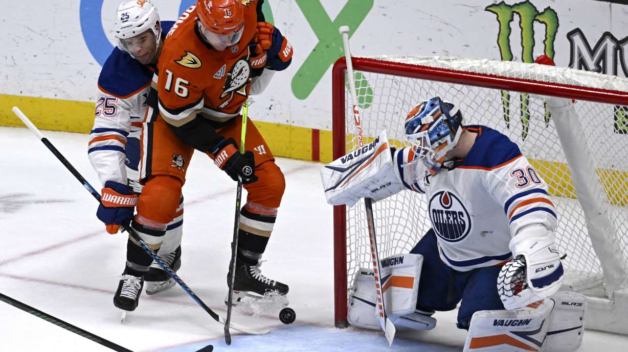 Anaheim Ducks center Ryan Strome (16) shoots to score against Edmonton Oilers goaltender Calvin Pickard (30) and defenseman Darnell Nurse (25) during the third period of an NHL hockey game in Anaheim, Calif., Sunday, Dec. 29, 2024.