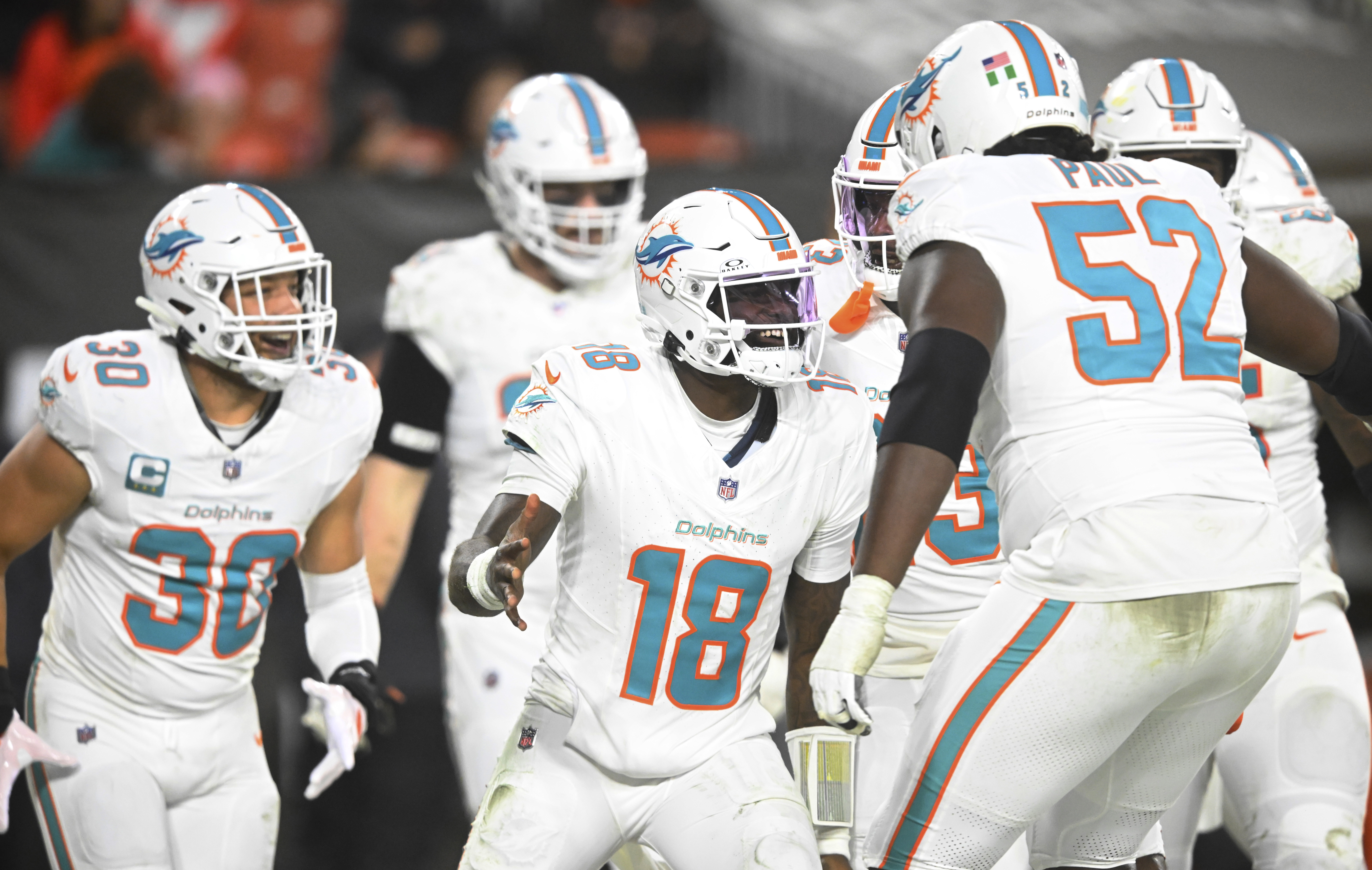 Miami Dolphins quarterback Tyler Huntley (18) celebrates after scoring a touchdown during the second half of an NFL football game against the Cleveland Browns Sunday, Dec. 29, 2024, in Cleveland.