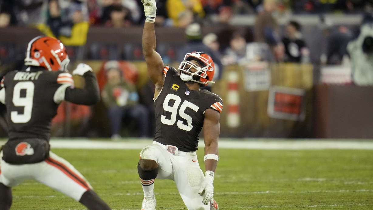 Cleveland Browns defensive end Myles Garrett (95) celebrates after sacking Miami Dolphins quarterback Tyler Huntley during the second half of an NFL football game Sunday, Dec. 29, 2024, in Cleveland.