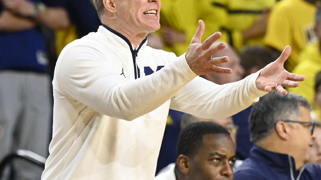 Michigan head coach Dusty May reacts during the first half of an NCAA college basketball game against Western Kentucky, Sunday, Dec. 29, 2024, in Ann Arbor, Mich.