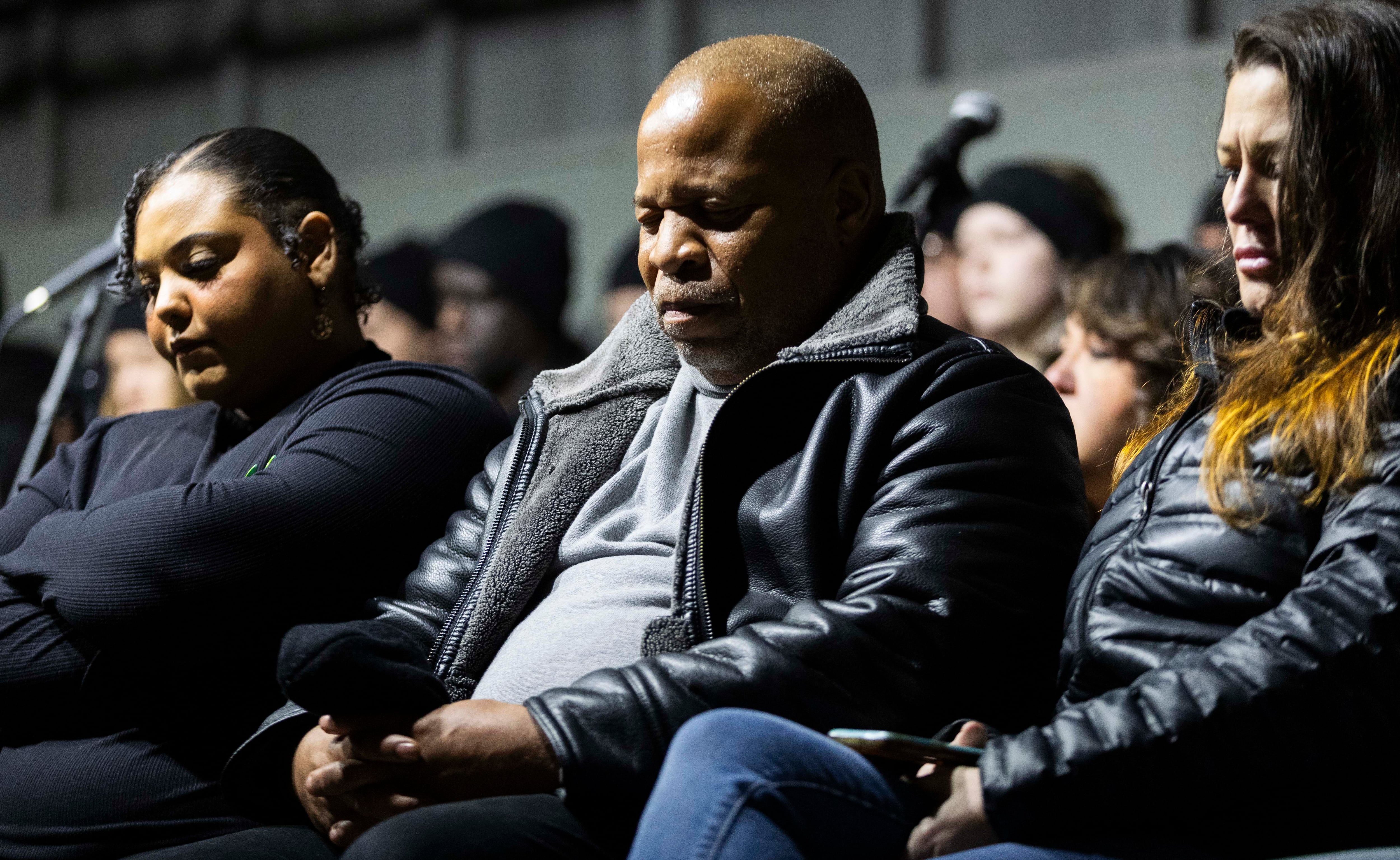 Pastor Shawn Clay, center, bows his head and closes his eyes during a moment of silence to remember those who have died during the annual Homeless Persons’ Memorial Vigil, hosted by the Salt Lake Valley Coalition to End Homelessness, in Pioneer Park in Salt Lake City on Dec. 19.